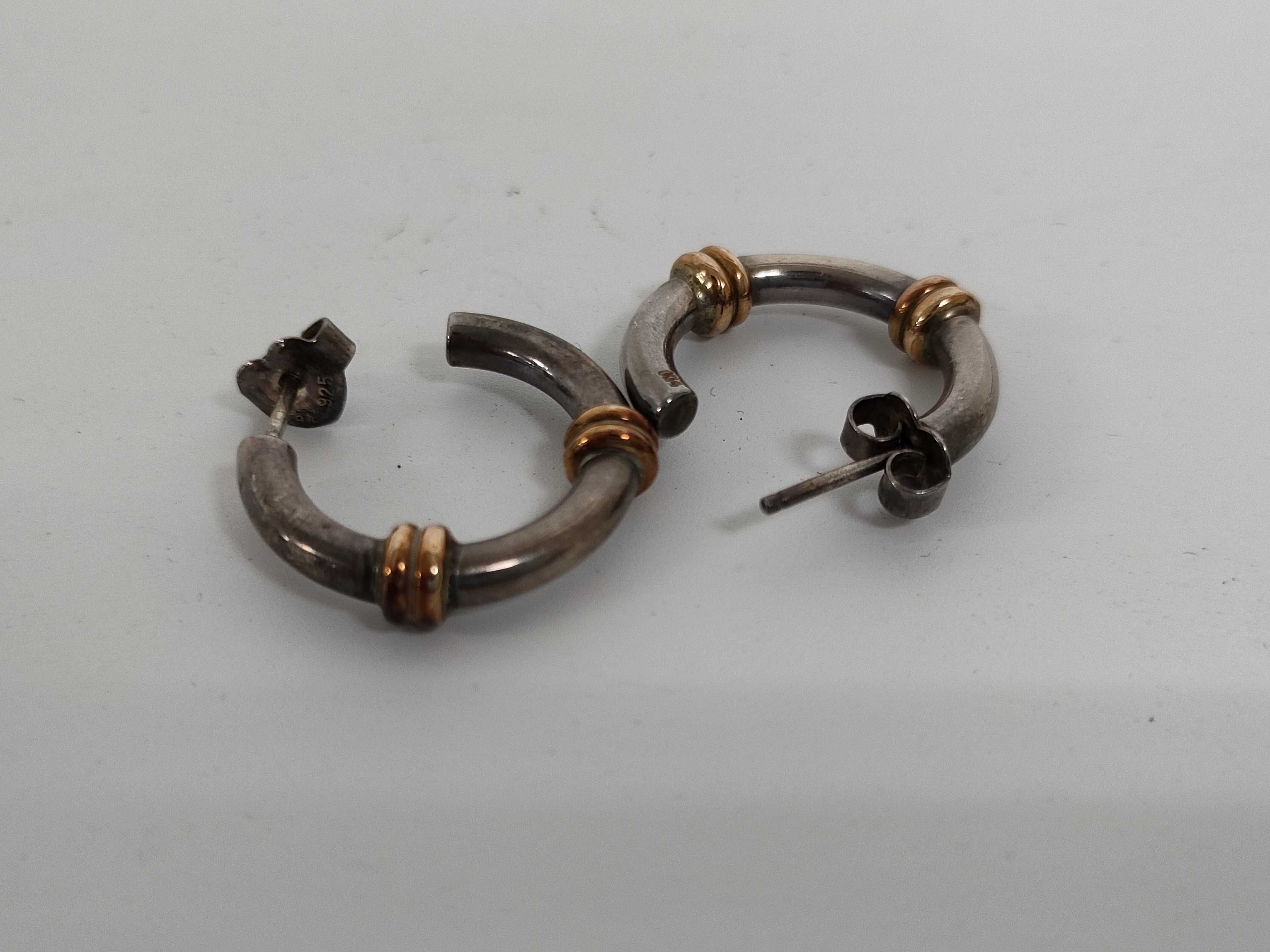 A Pair of Sterling Silver and 14 Karat Gold Two-Tone Hoop Earrings