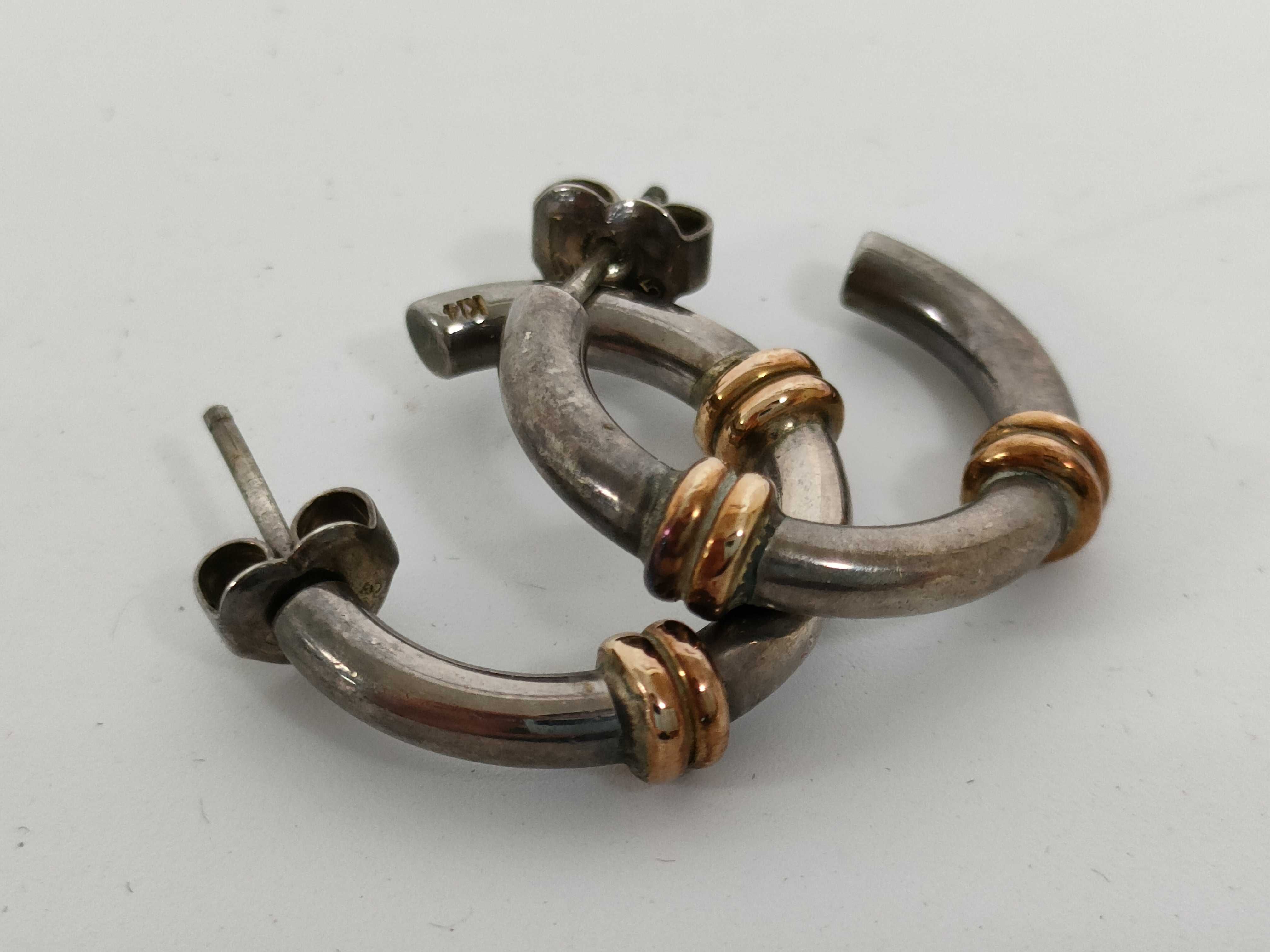 A Pair of Sterling Silver and 14 Karat Gold Two-Tone Hoop Earrings