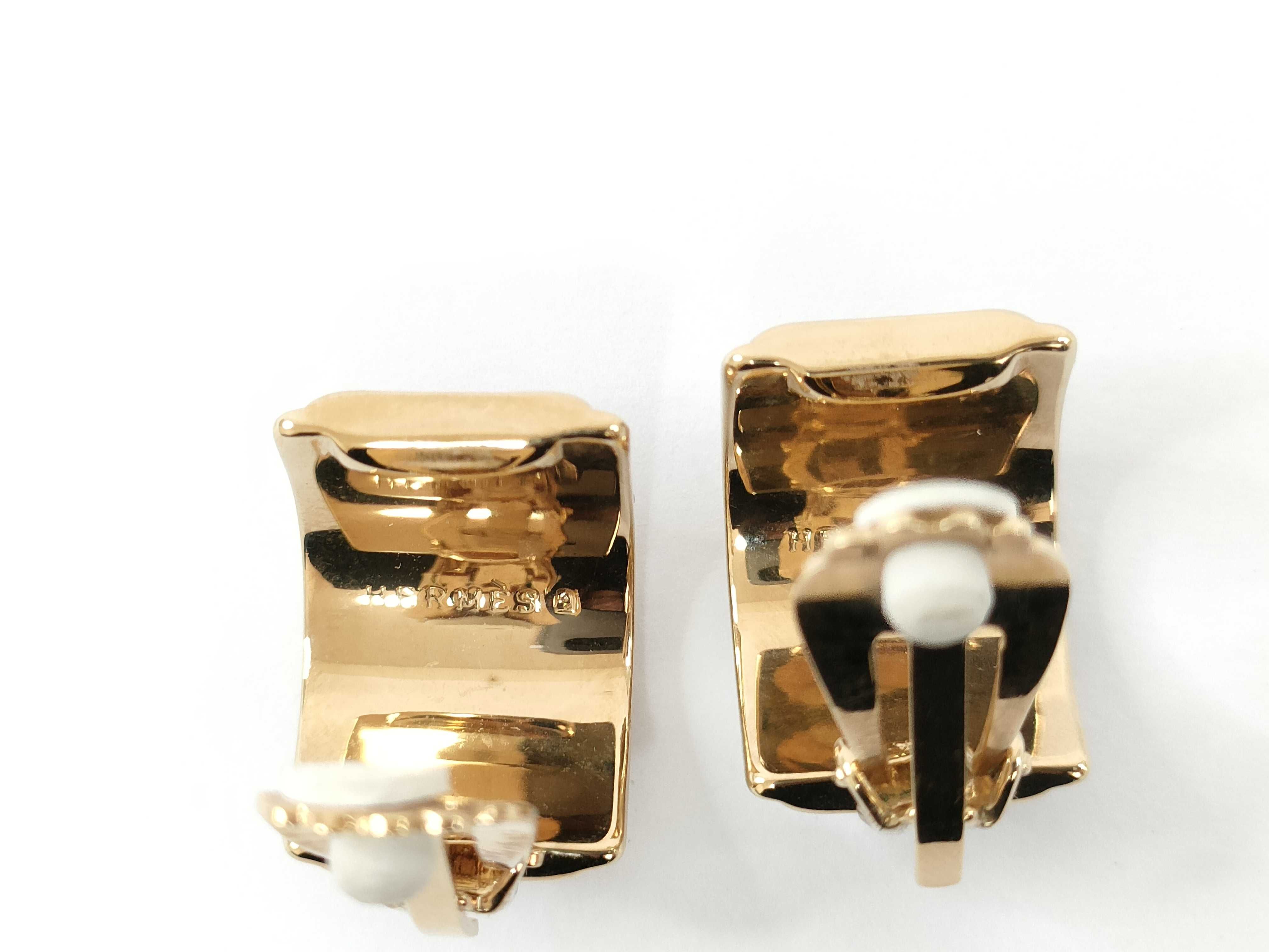 A Pair of Hermes Enameled Gold-Tone Clip-On Hoop Earrings