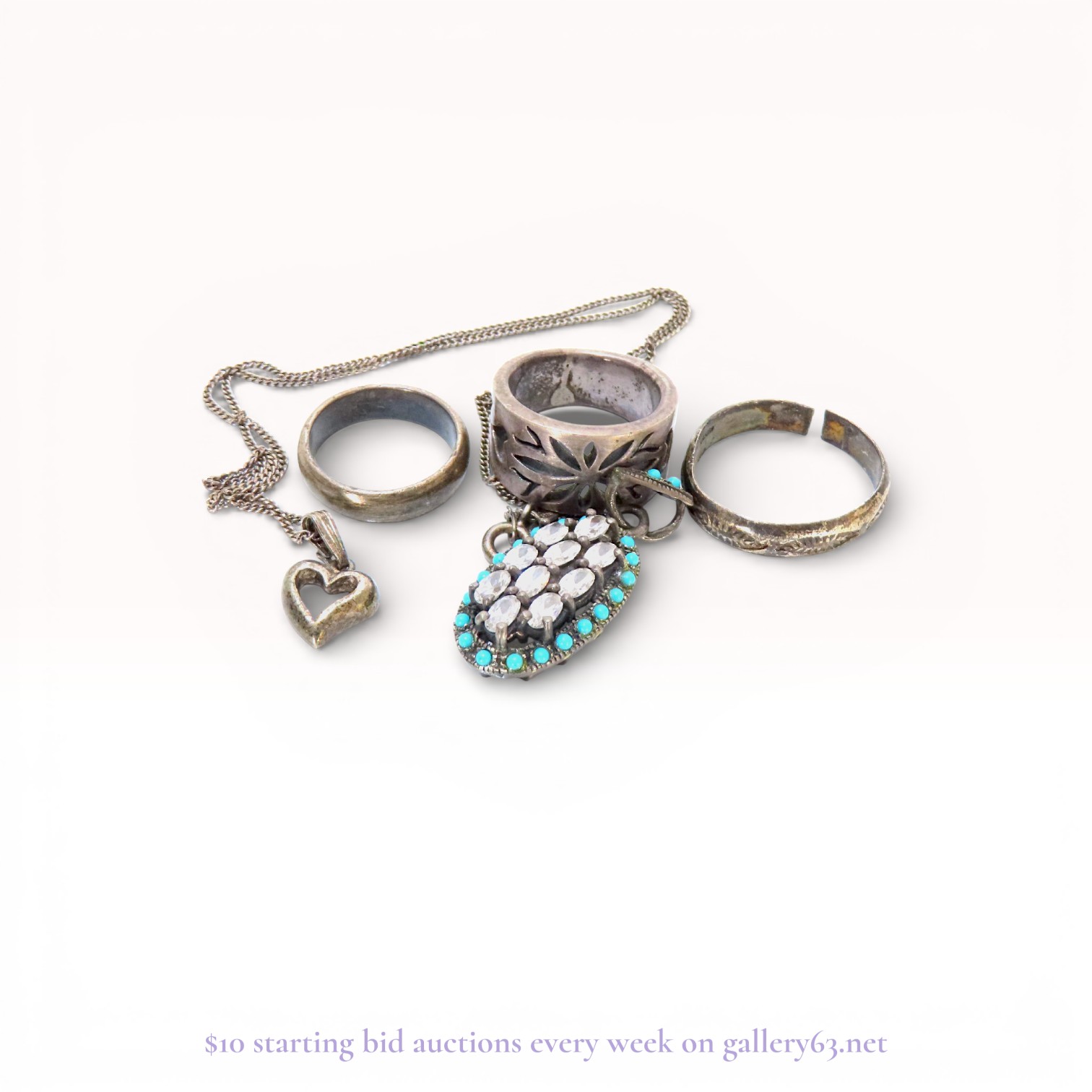 An Assortment of Five Pieces of Sterling Silver and Costume Jewelry