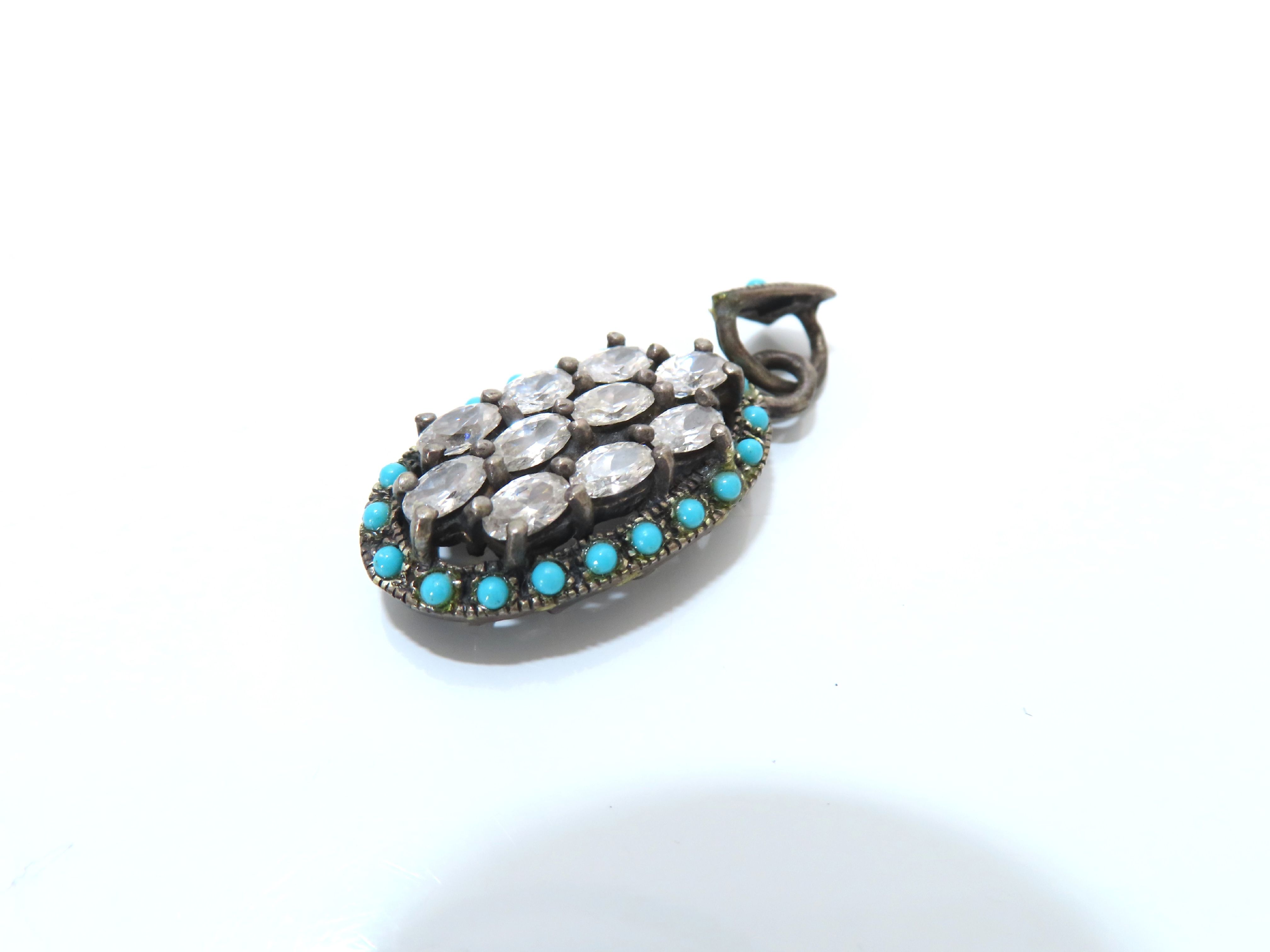 An Assortment of Five Pieces of Sterling Silver and Costume Jewelry