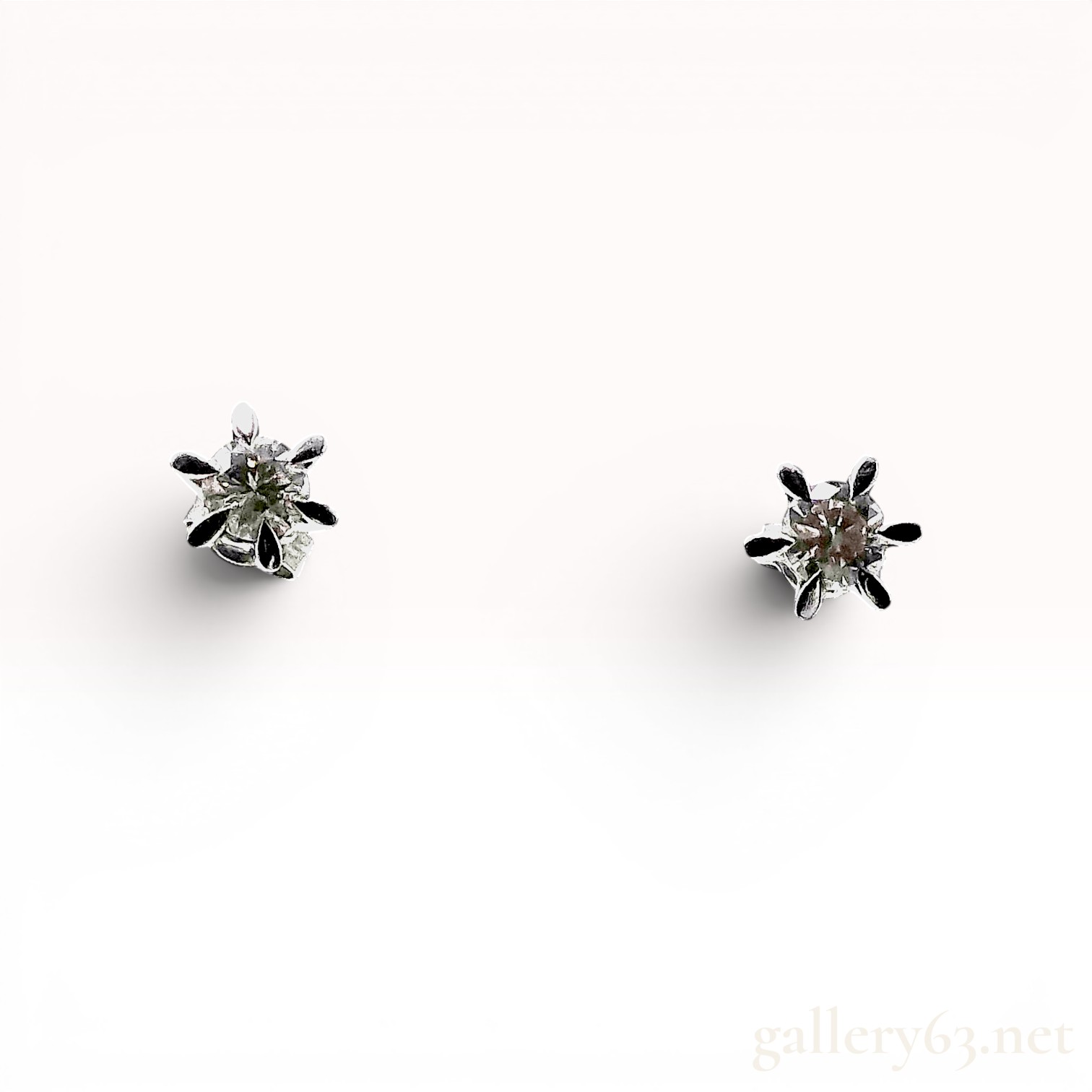 A Pair of Platinum and Diamond Solitaire Stud Earrings