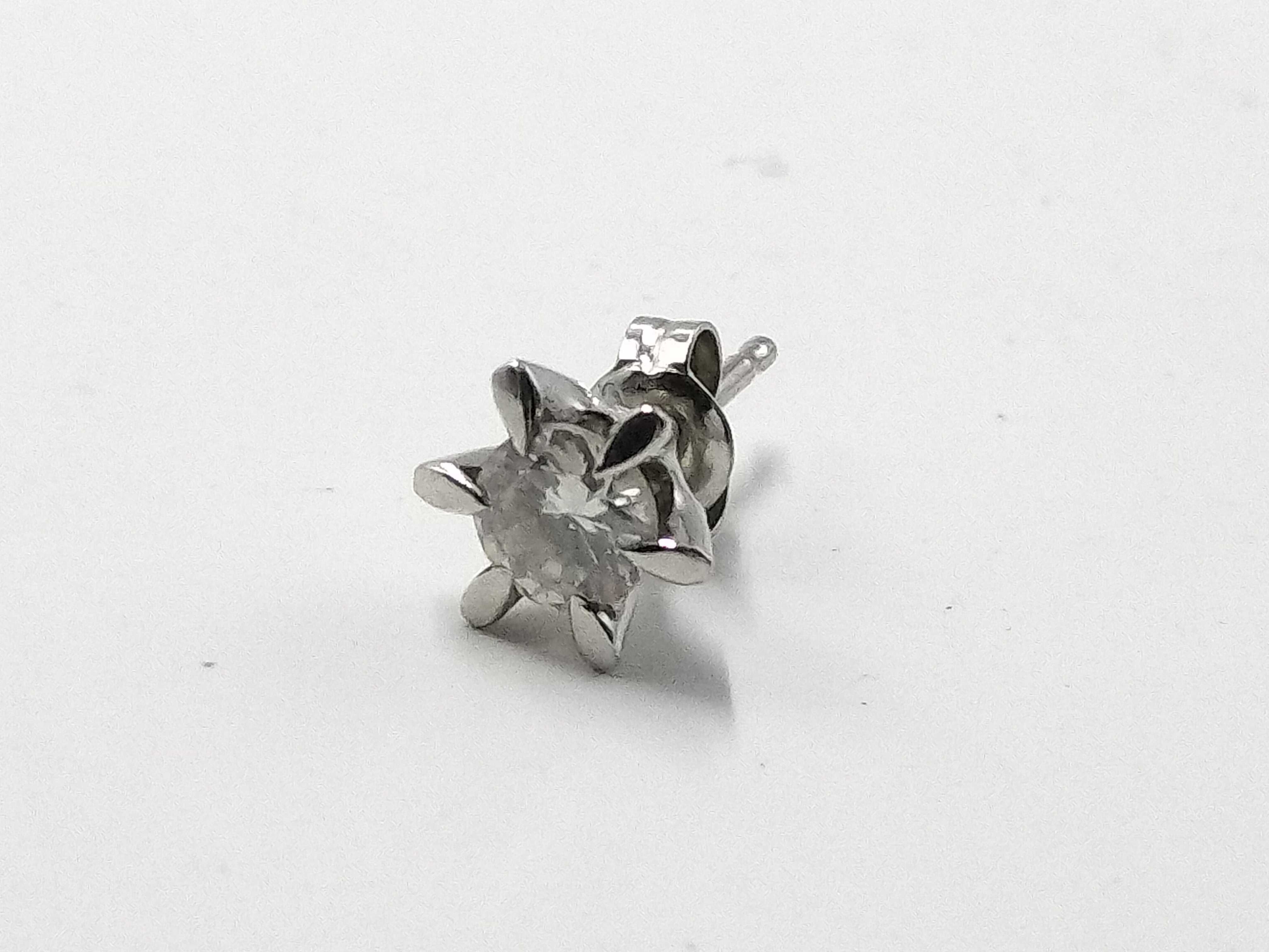 A Pair of Platinum and Diamond Solitaire Stud Earrings