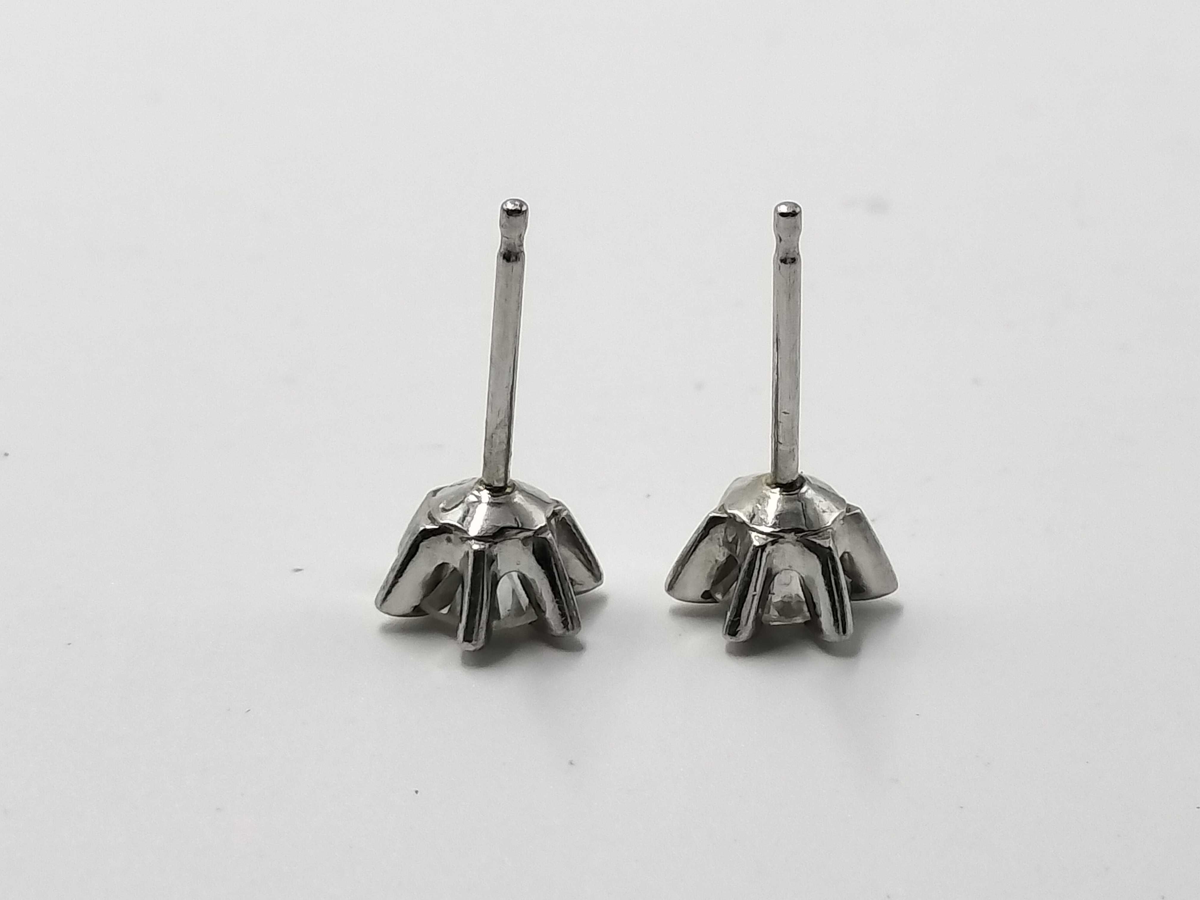 A Pair of Platinum and Diamond Solitaire Stud Earrings