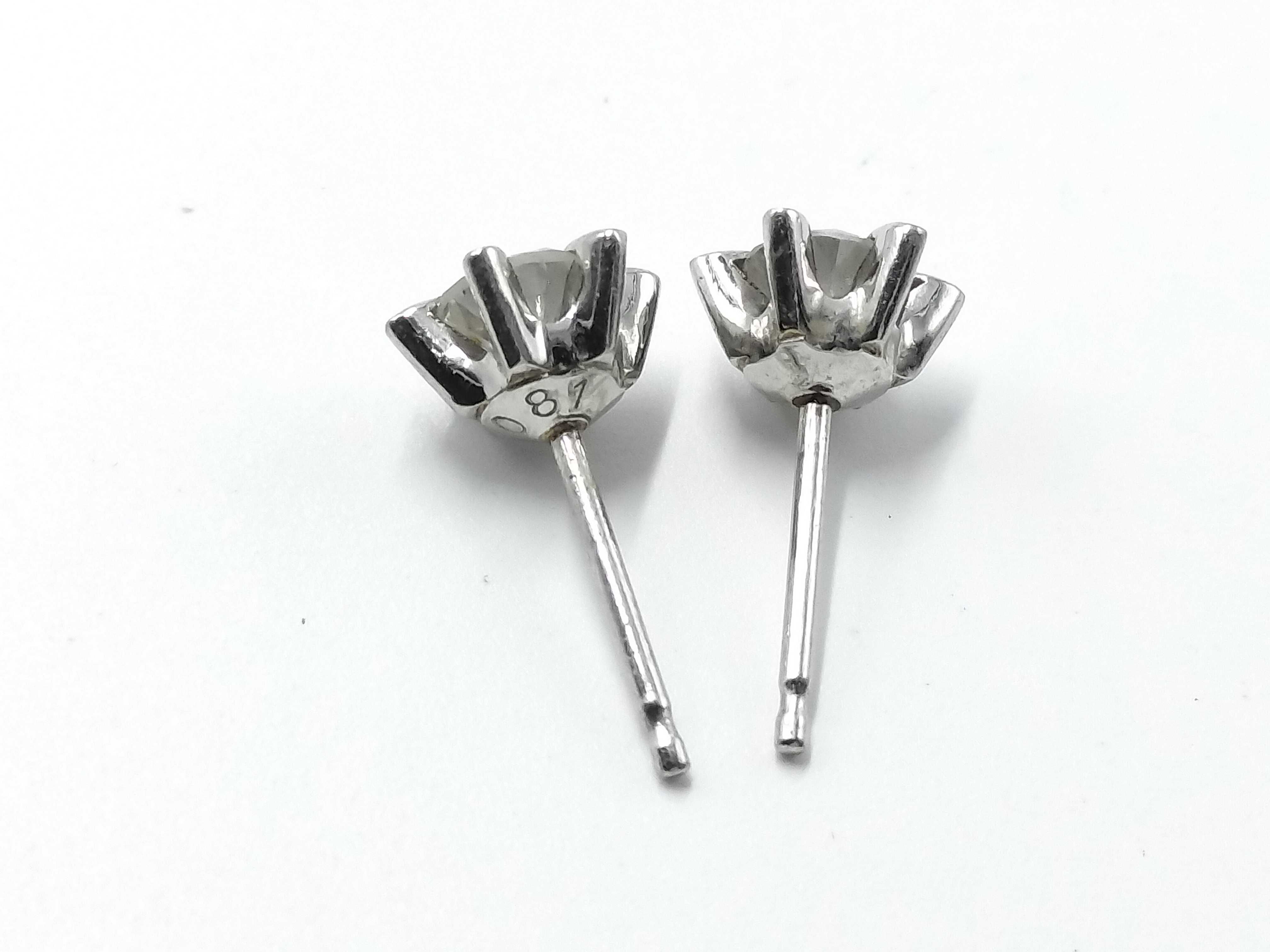 A Pair of Platinum and Diamond Solitaire Stud Earrings