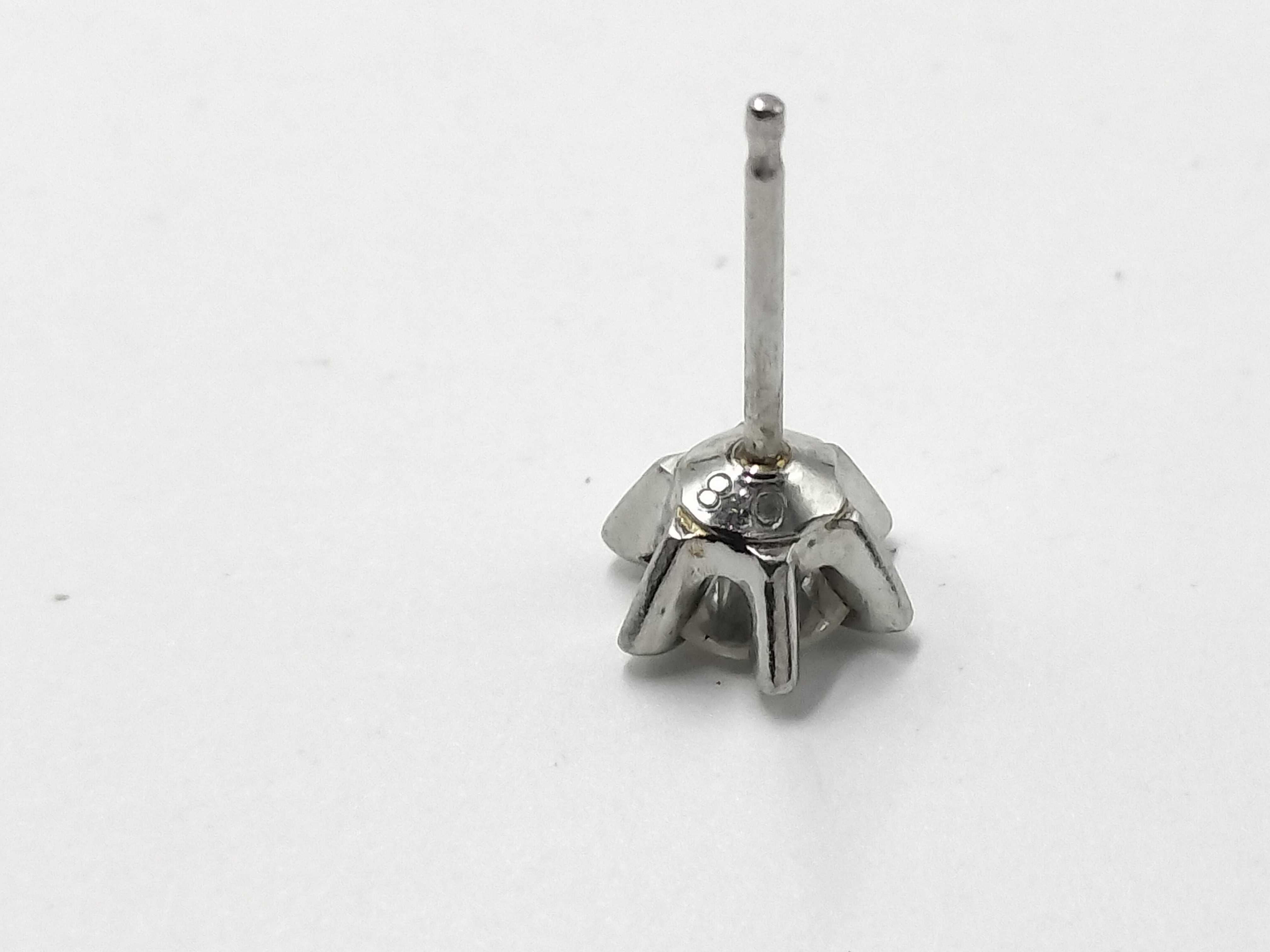 A Pair of Platinum and Diamond Solitaire Stud Earrings