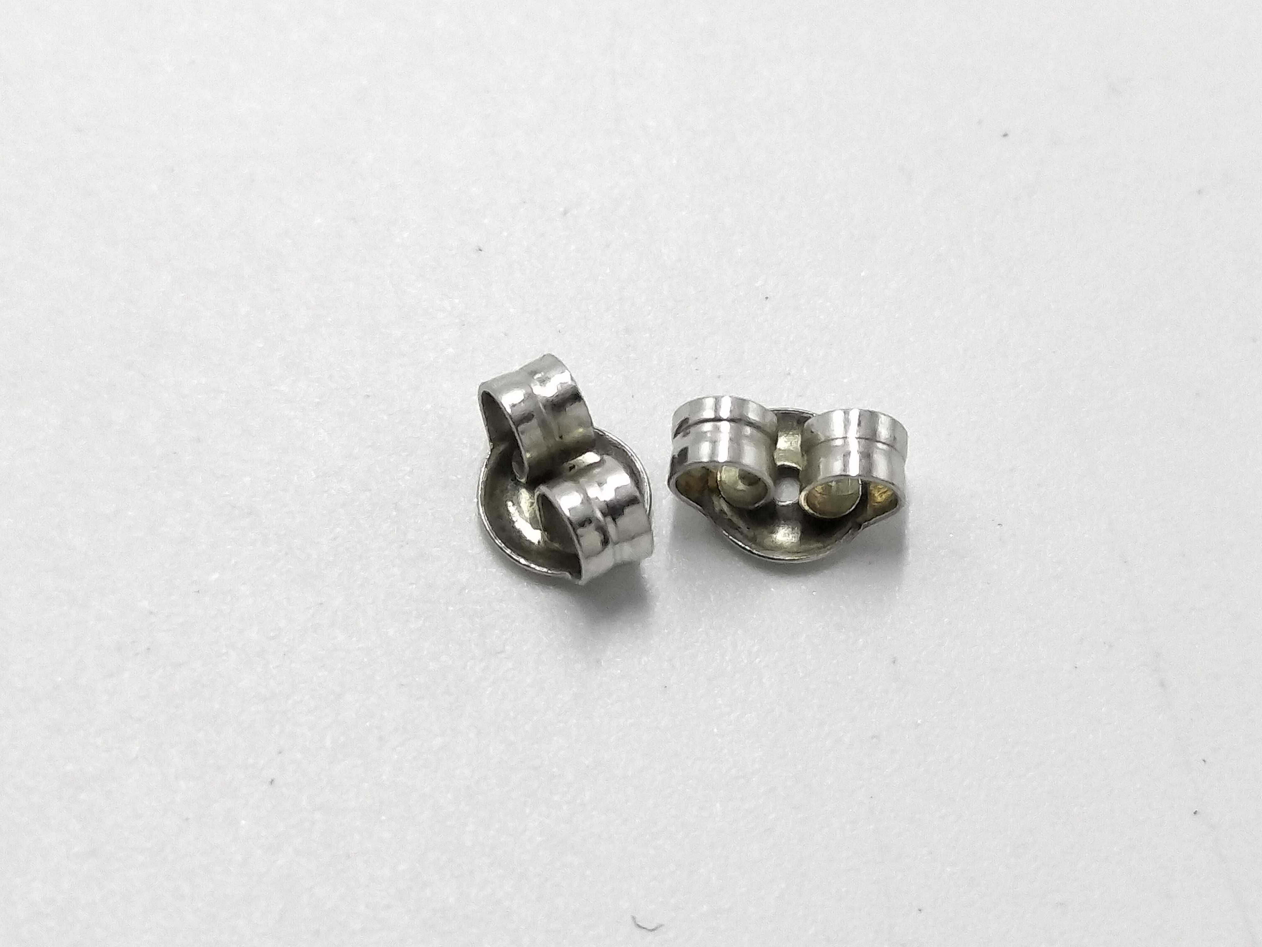 A Pair of Platinum and Diamond Solitaire Stud Earrings