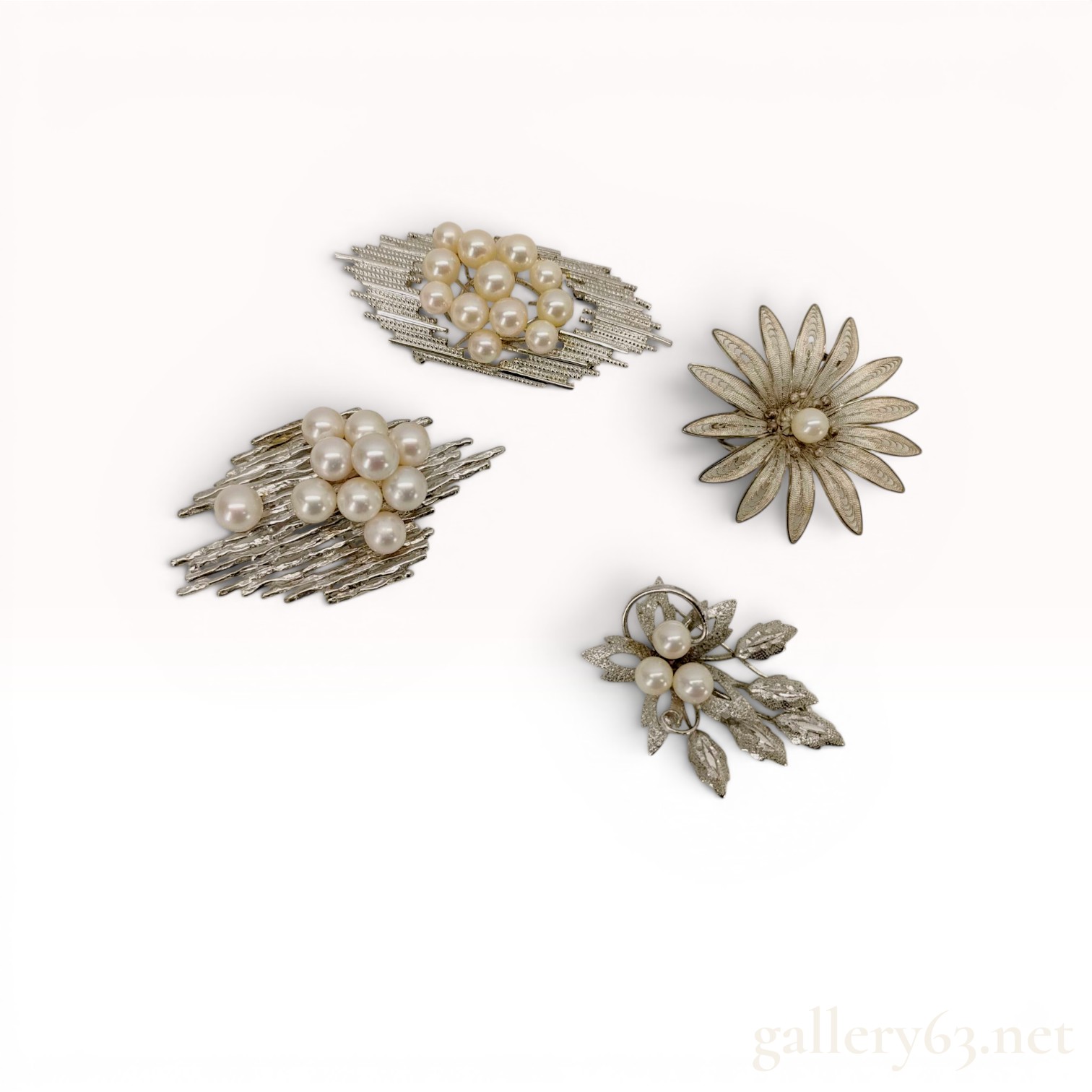 A Group of Mid-Century Sterling Silver and Cultured Pearl Pendants/Brooches