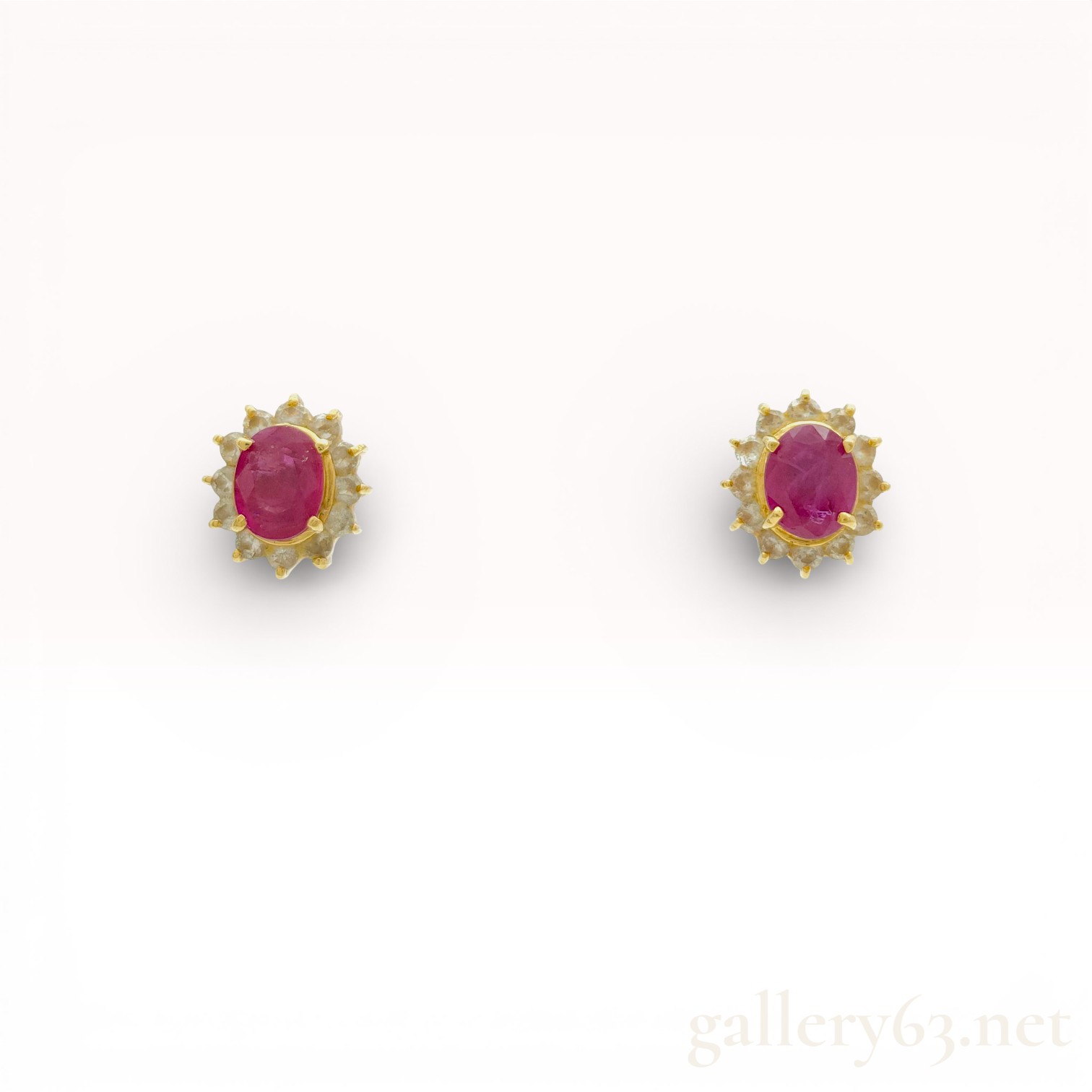 A Pair of 18K Yellow Gold Ruby and Diamond Halo Stud Earrings
