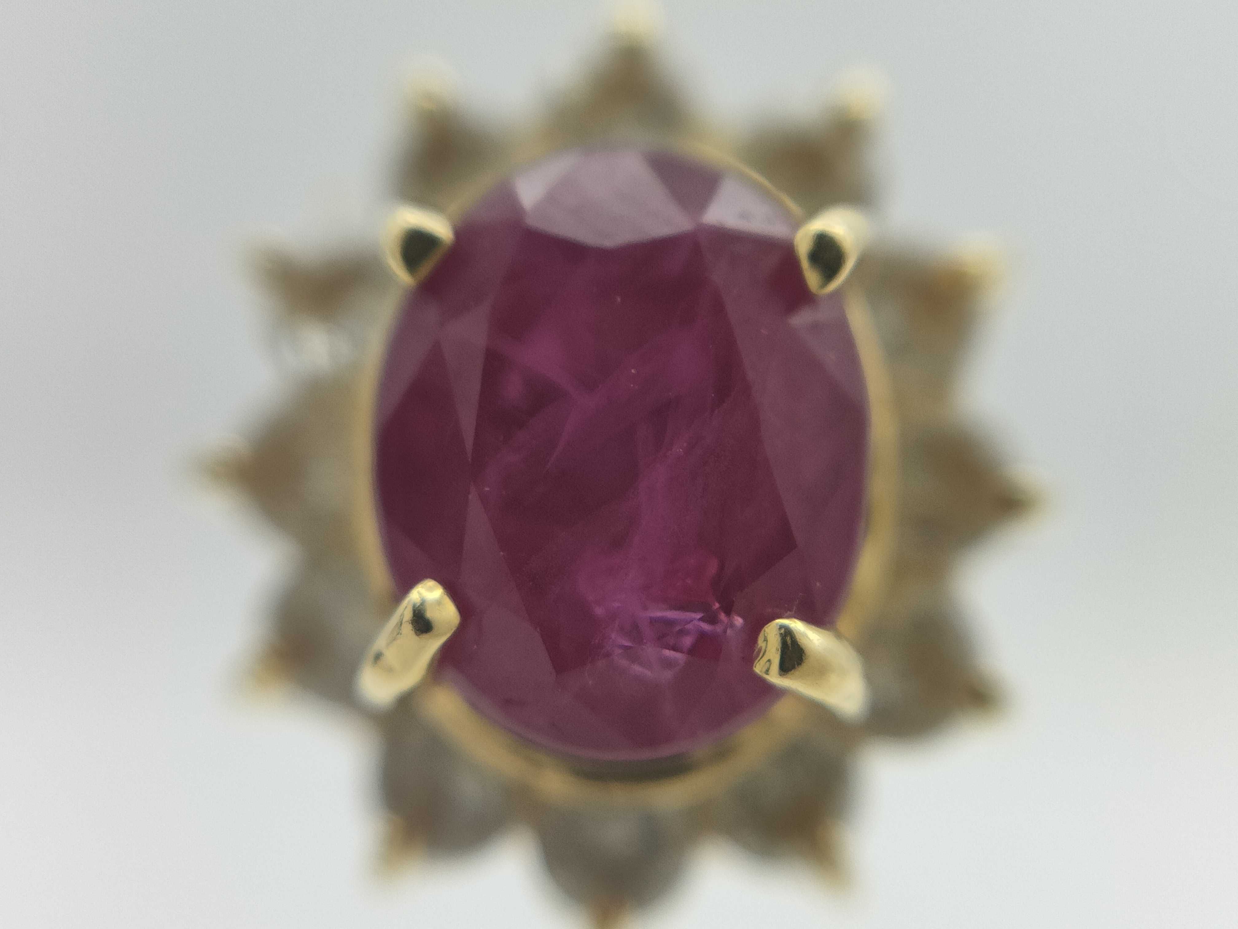 A Pair of 18K Yellow Gold Ruby and Diamond Halo Stud Earrings