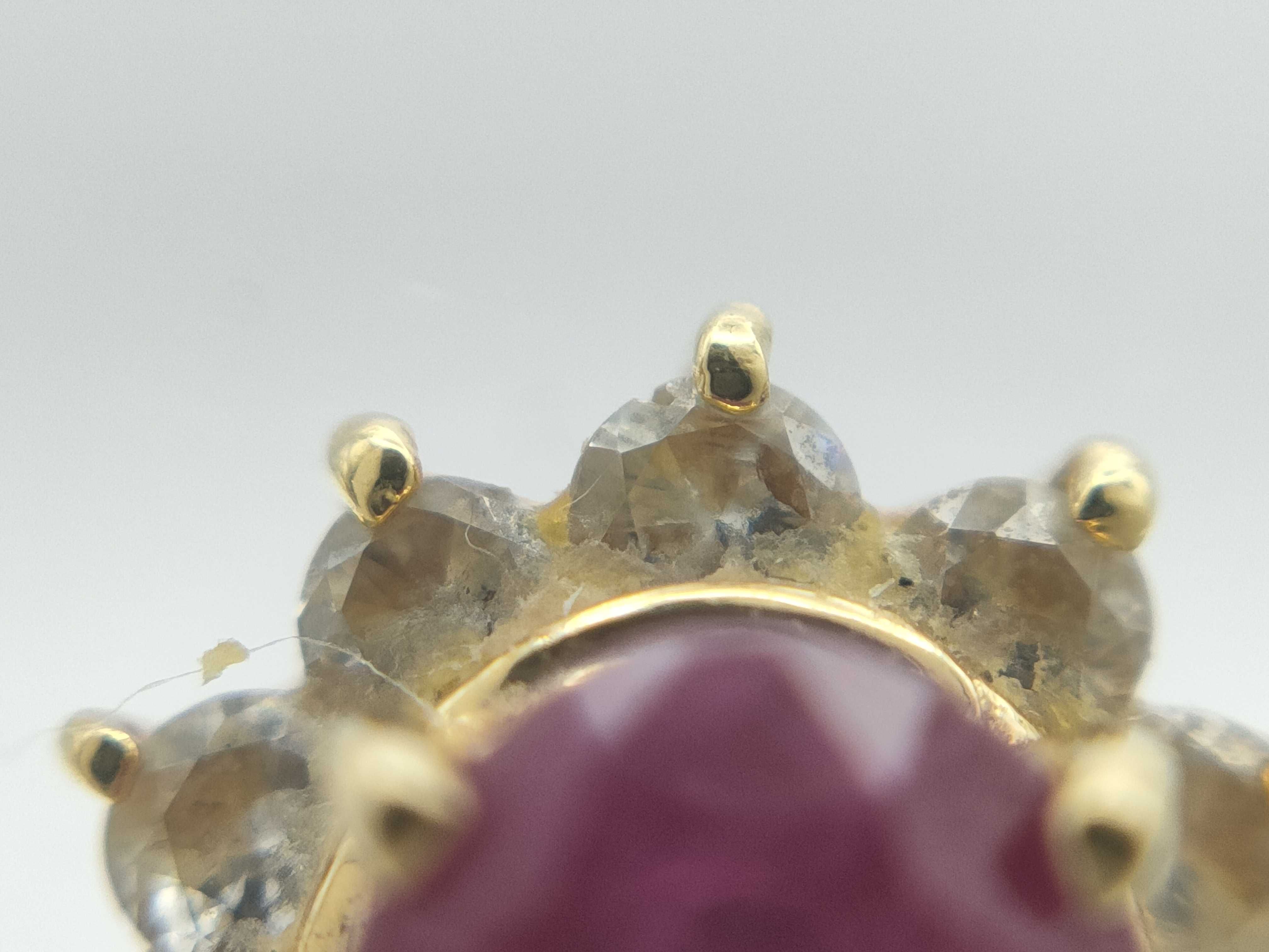 A Pair of 18K Yellow Gold Ruby and Diamond Halo Stud Earrings