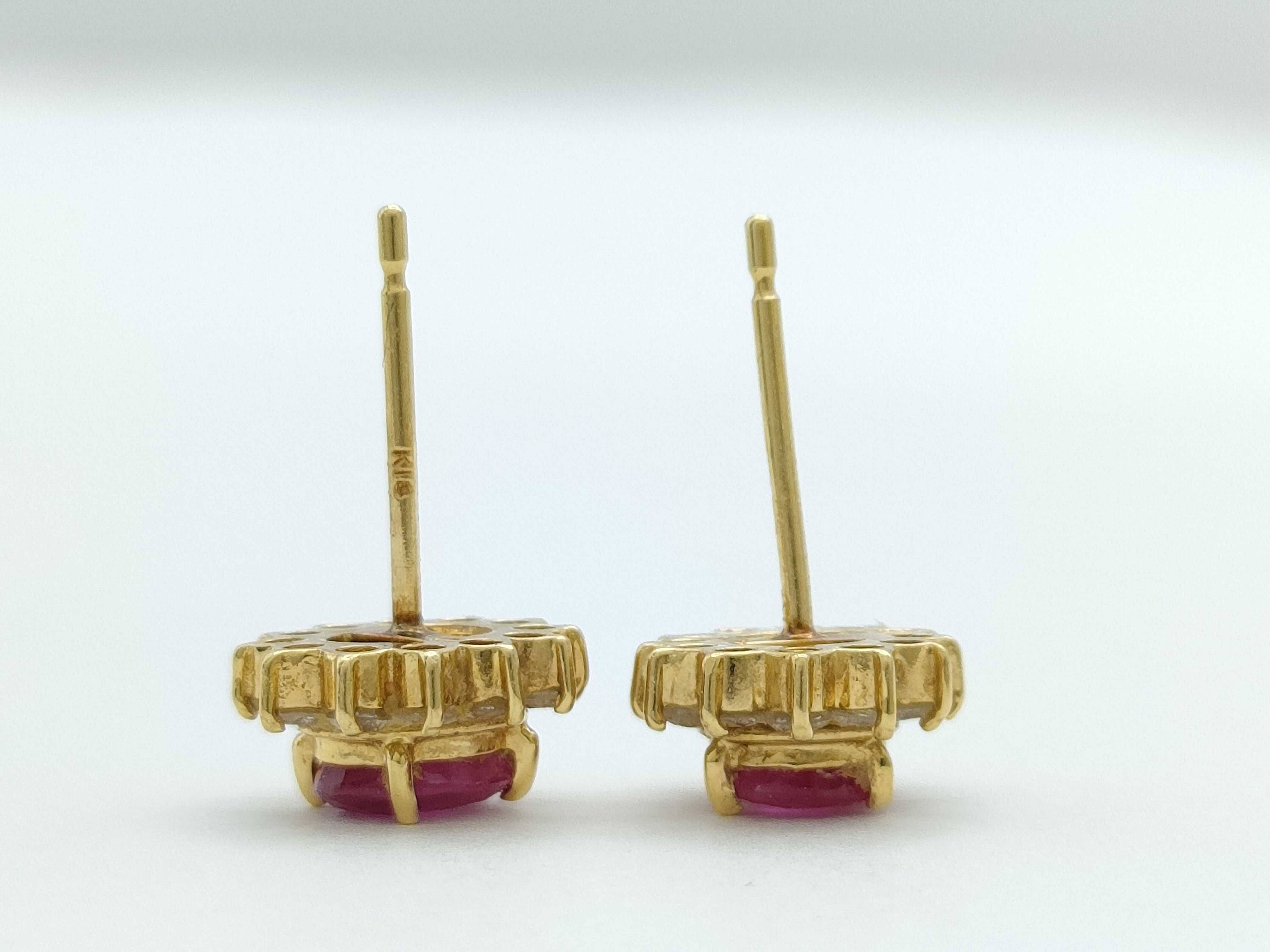 A Pair of 18K Yellow Gold Ruby and Diamond Halo Stud Earrings