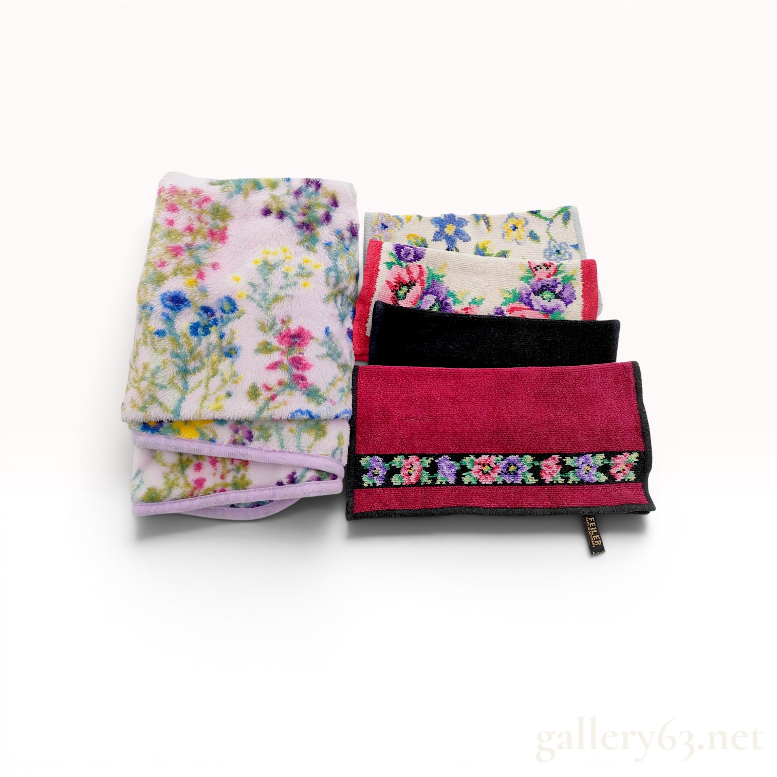 An Assortment of Feiler Floral Chenille Textiles and Plush Throw