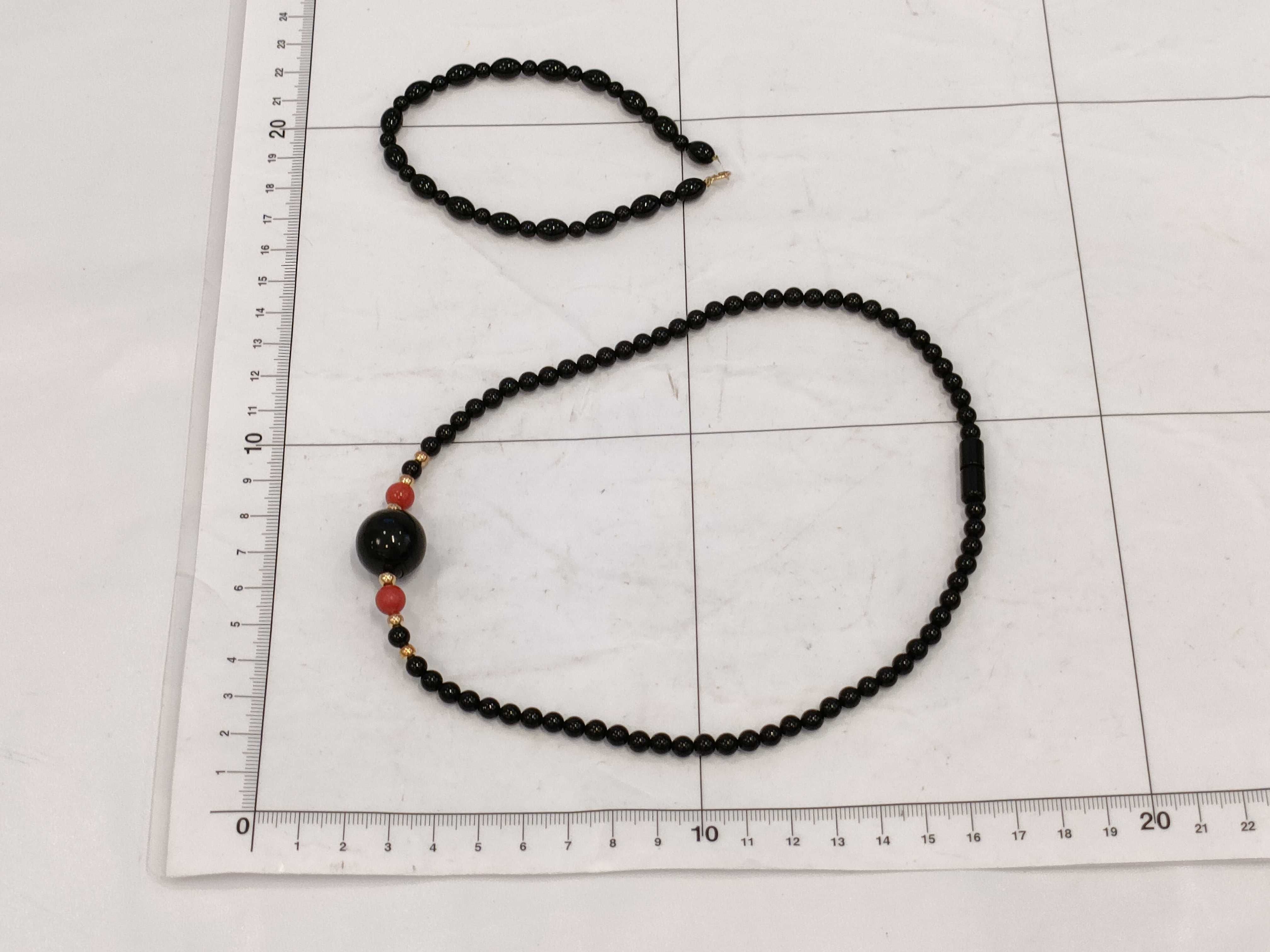 A Trio of Beaded Jewelry Including a Necklace and Two Bracelets
