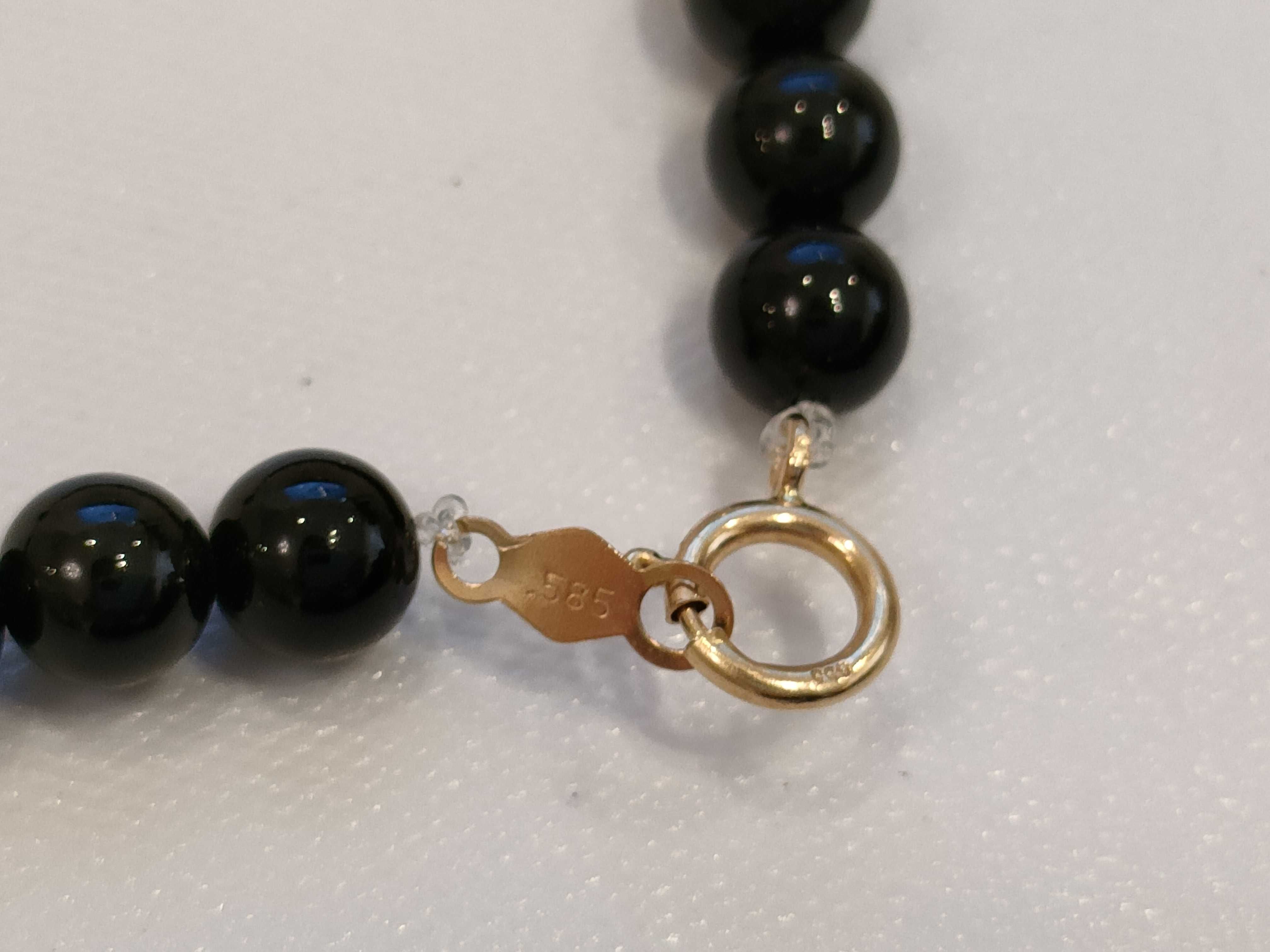 A Trio of Beaded Jewelry Including a Necklace and Two Bracelets