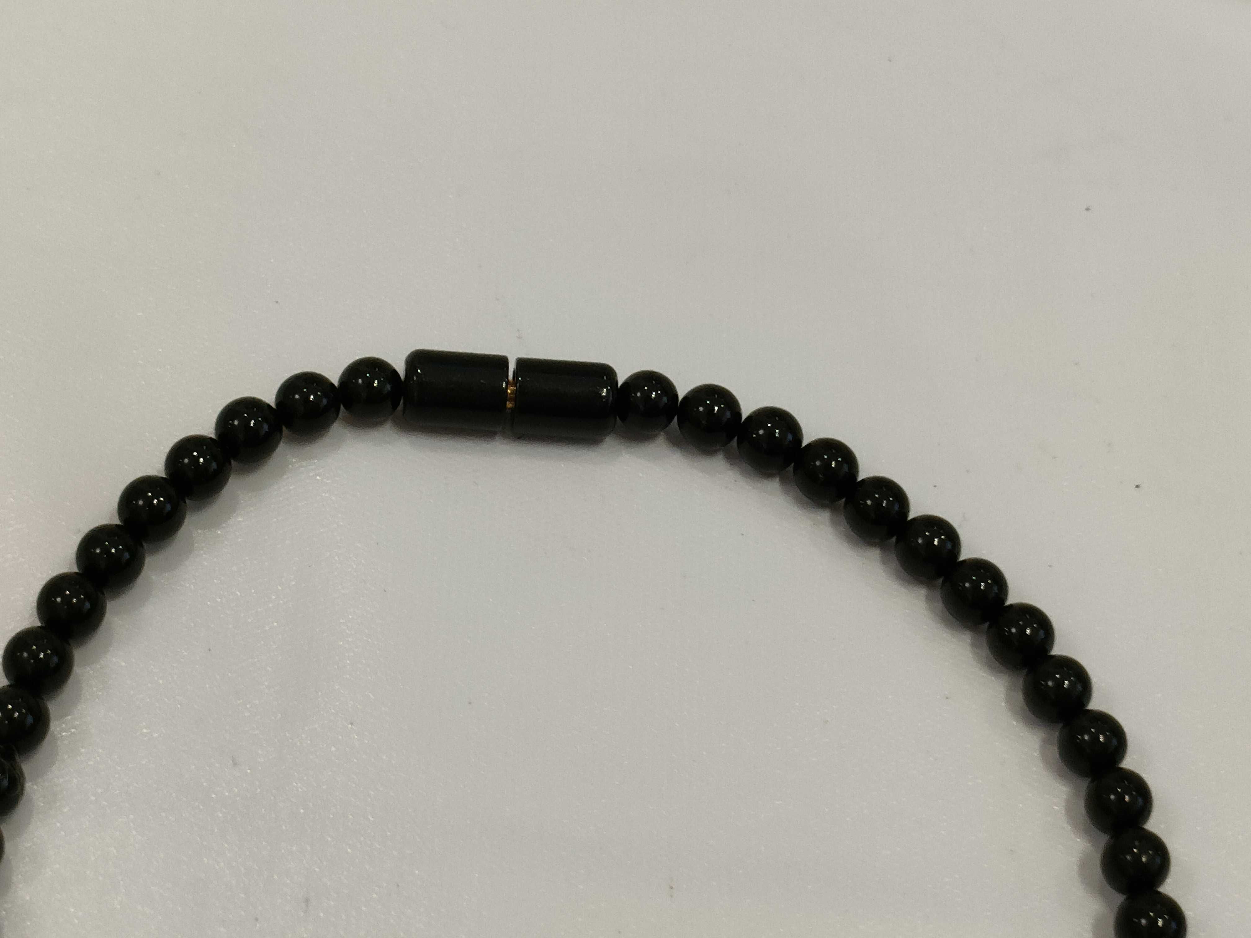 A Trio of Beaded Jewelry Including a Necklace and Two Bracelets