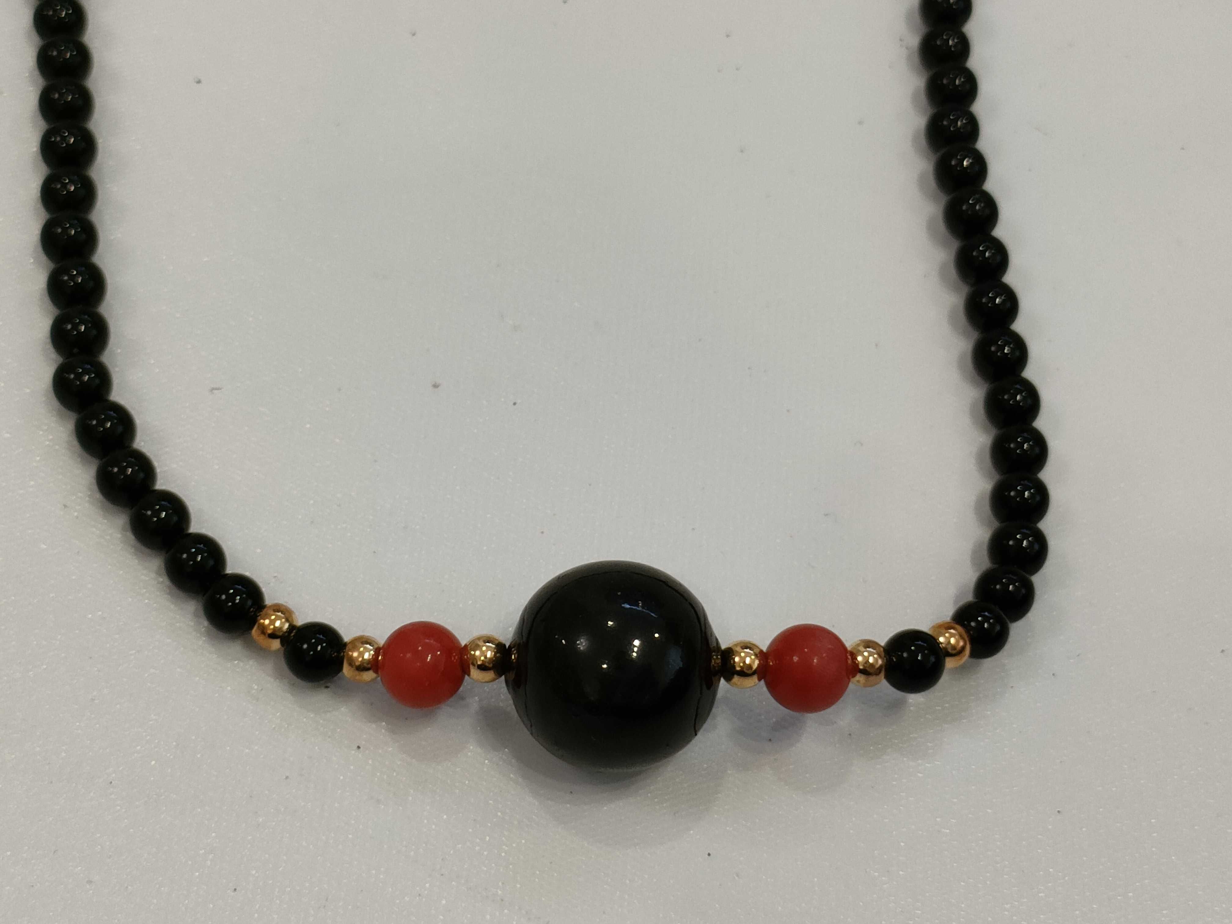 A Trio of Beaded Jewelry Including a Necklace and Two Bracelets