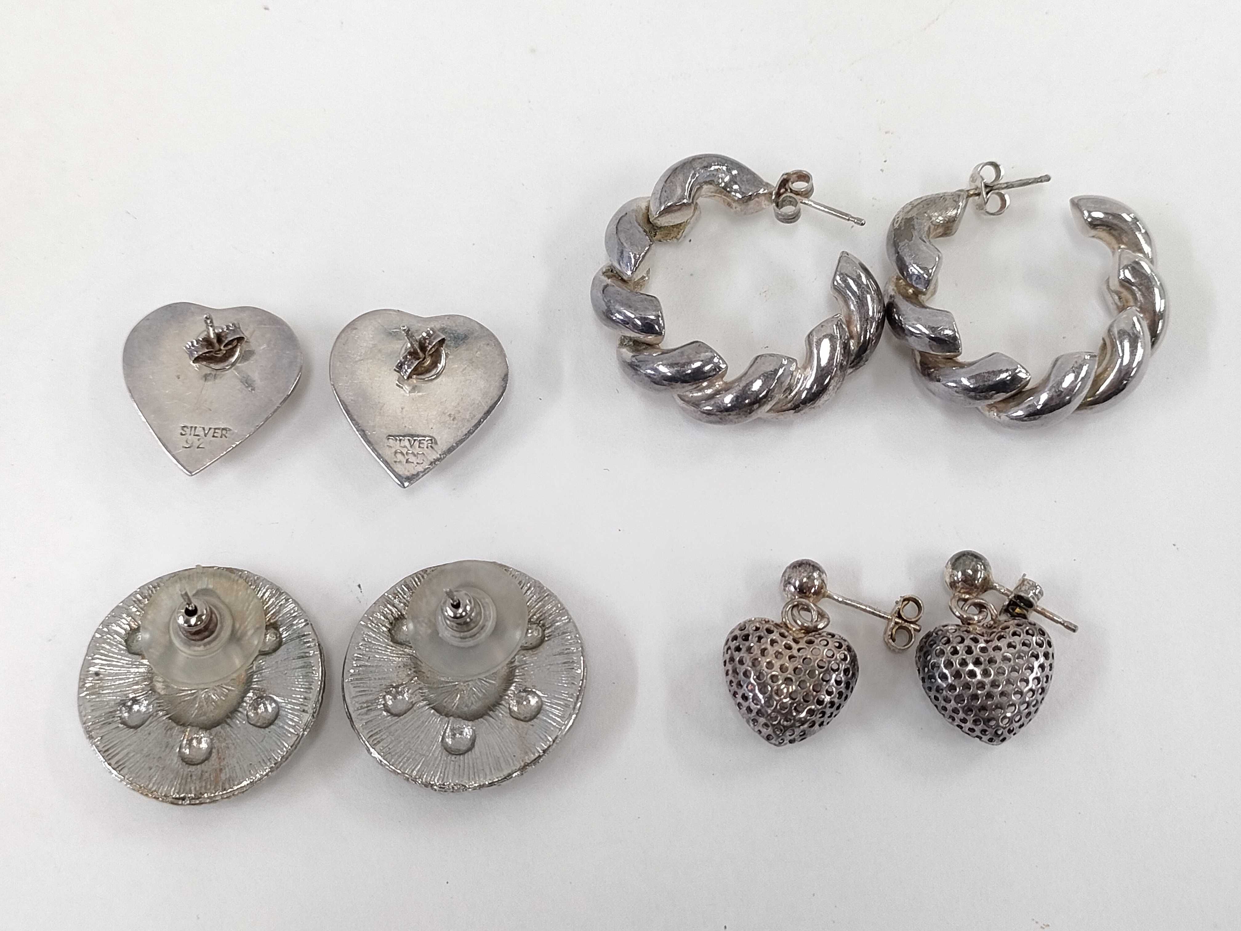 An Assortment of Four Pairs of Sterling Silver Earrings