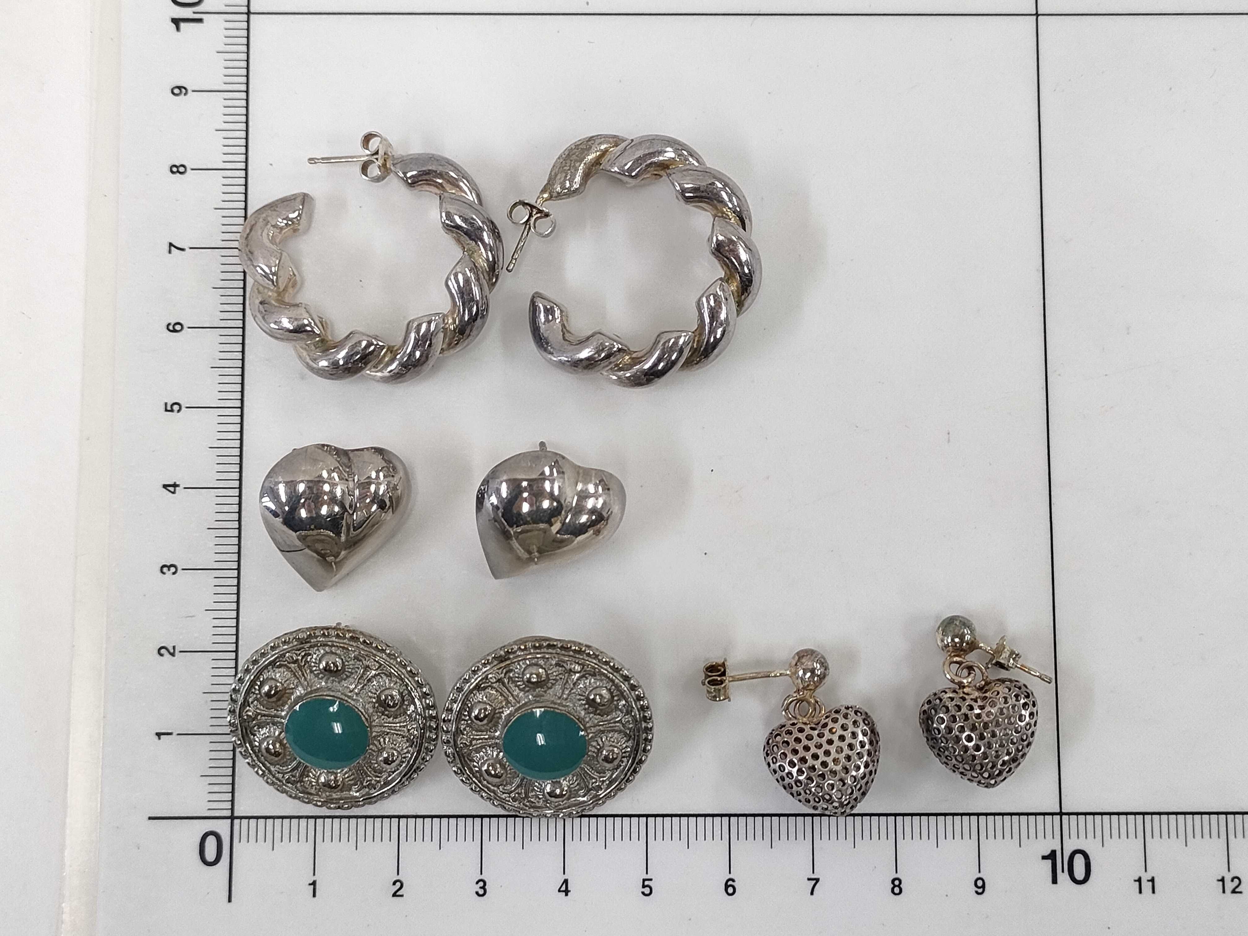 An Assortment of Four Pairs of Sterling Silver Earrings