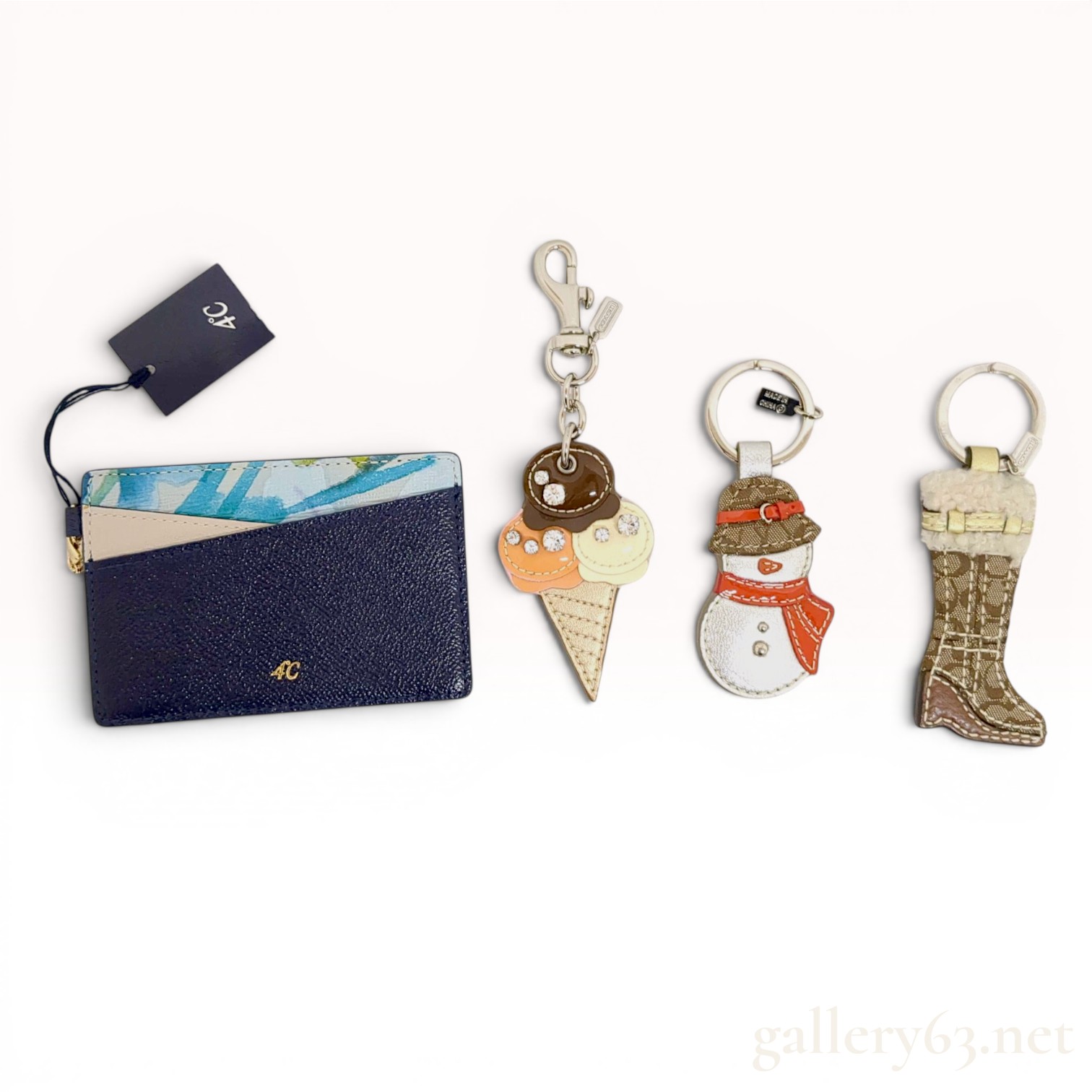 A Group of Designer Personal Accessories Including Coach Keychains and a 4C Card Holder w/Box