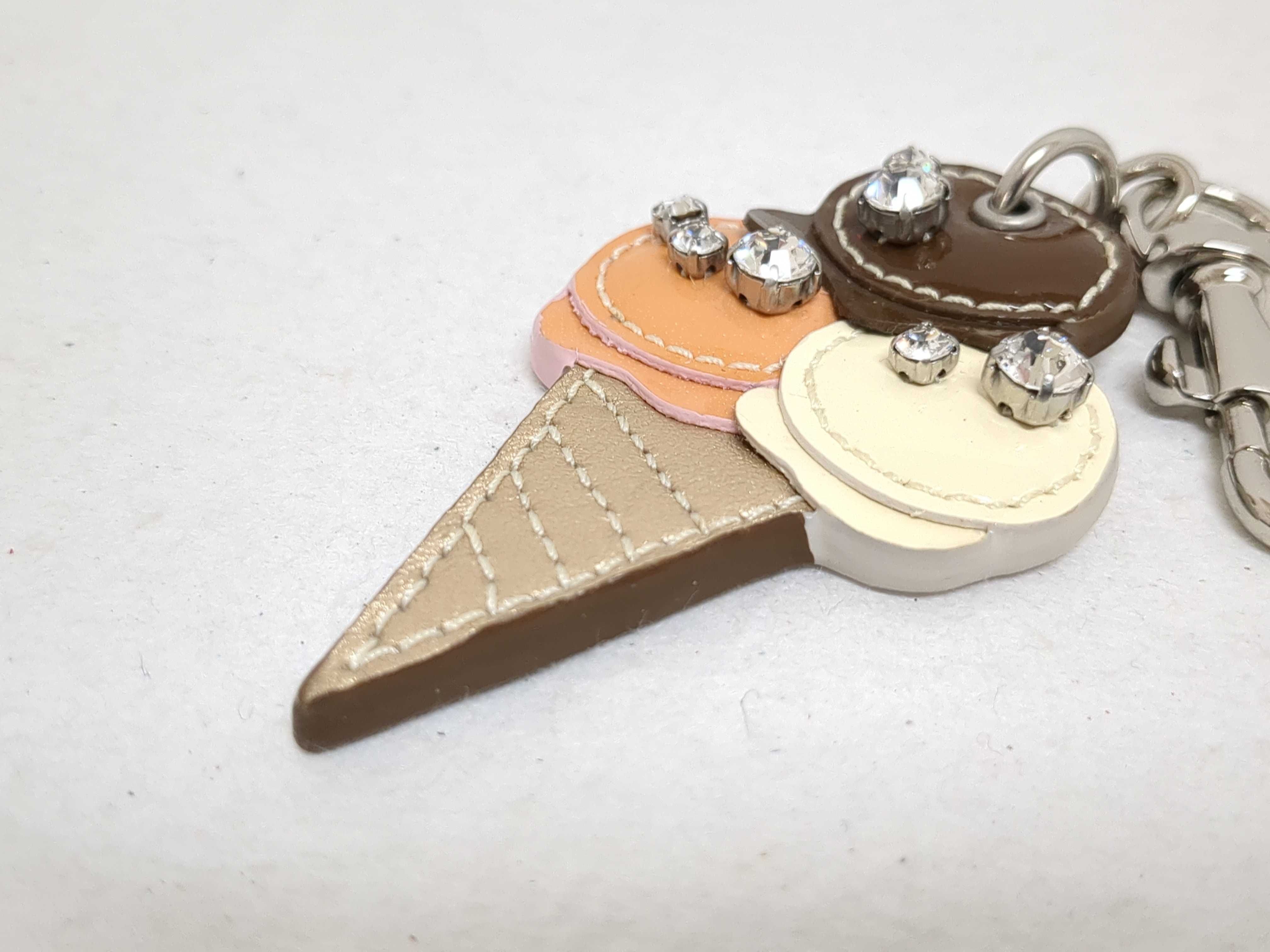 A Group of Designer Personal Accessories Including Coach Keychains and a 4C Card Holder w/Box