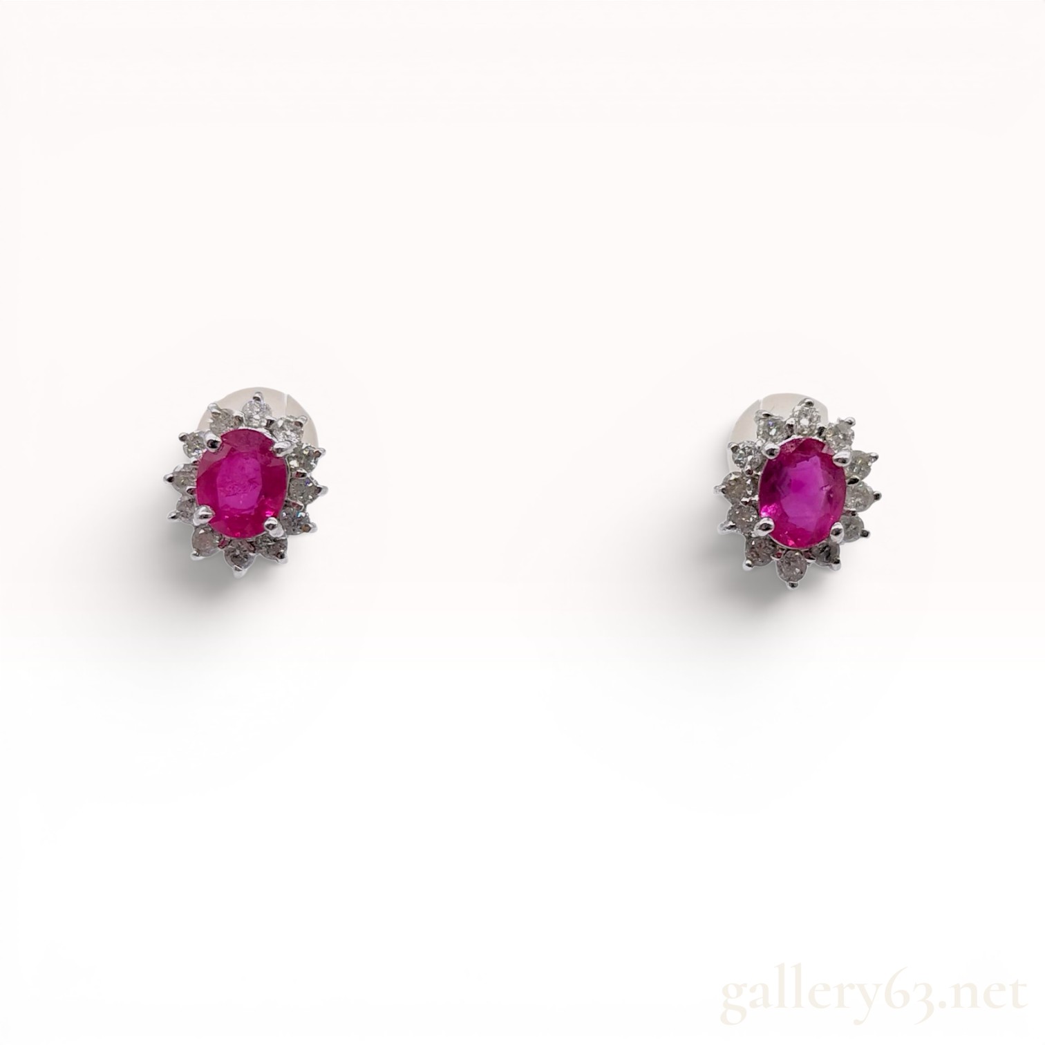 A Pair of Ruby and Diamond Cluster Stud Earrings in 18K White Gold