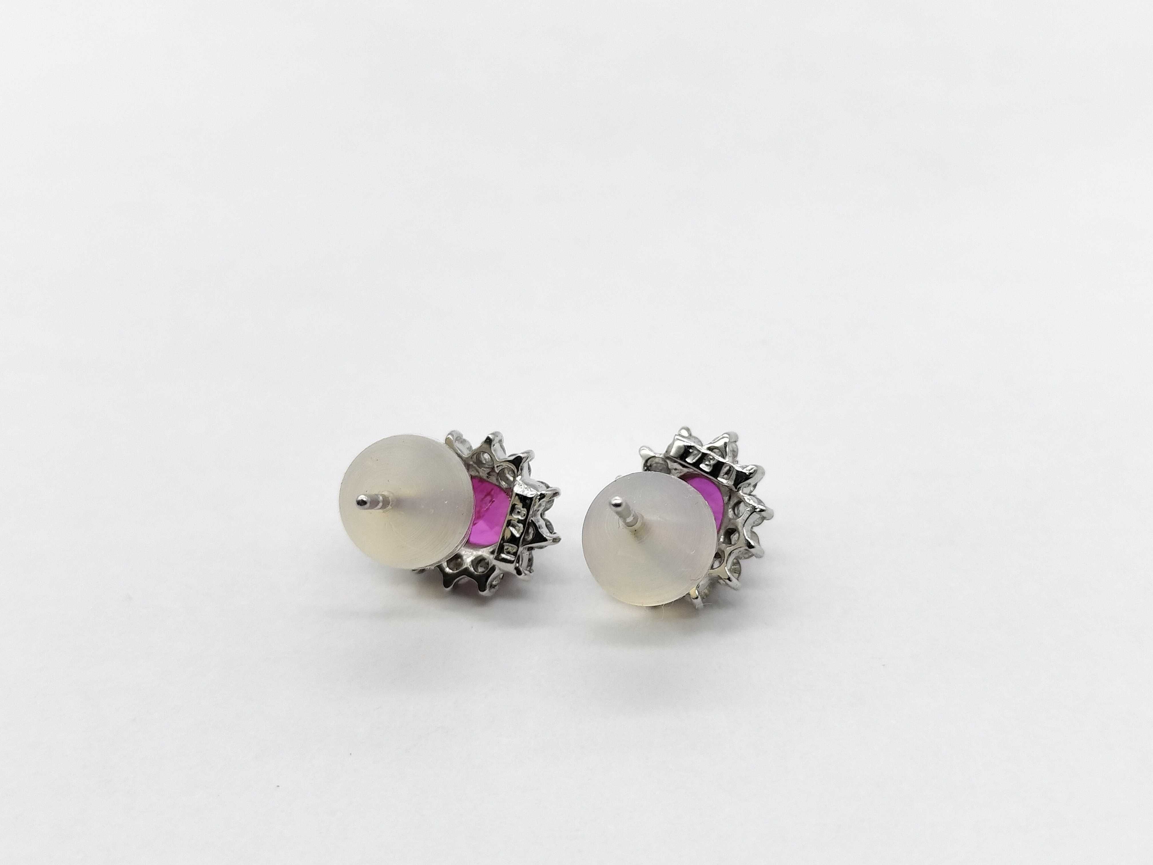 A Pair of Ruby and Diamond Cluster Stud Earrings in 18K White Gold