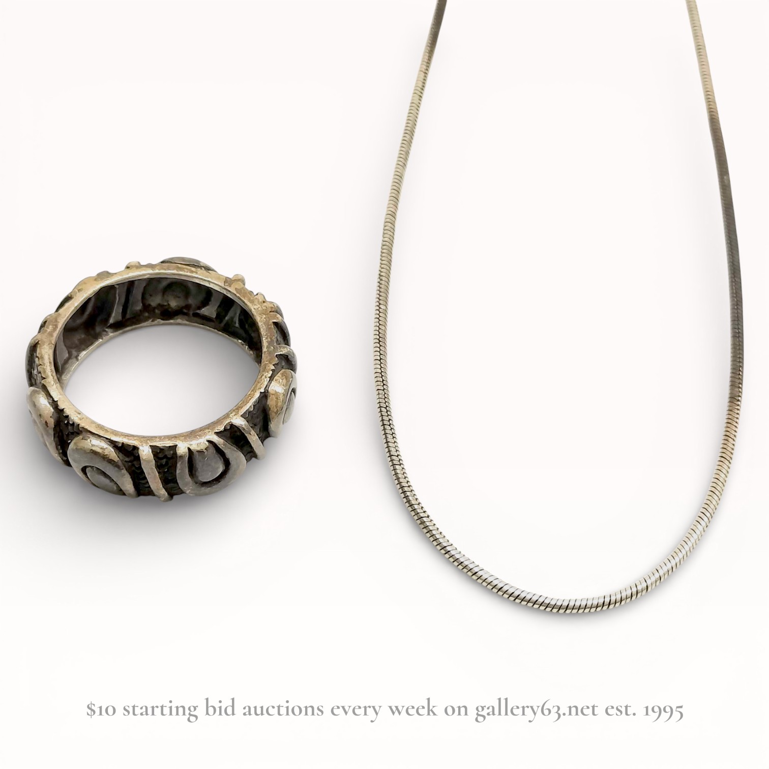 Two Sterling Silver Jewelry Items Including a Snake Chain Necklace and Artisan Band Ring