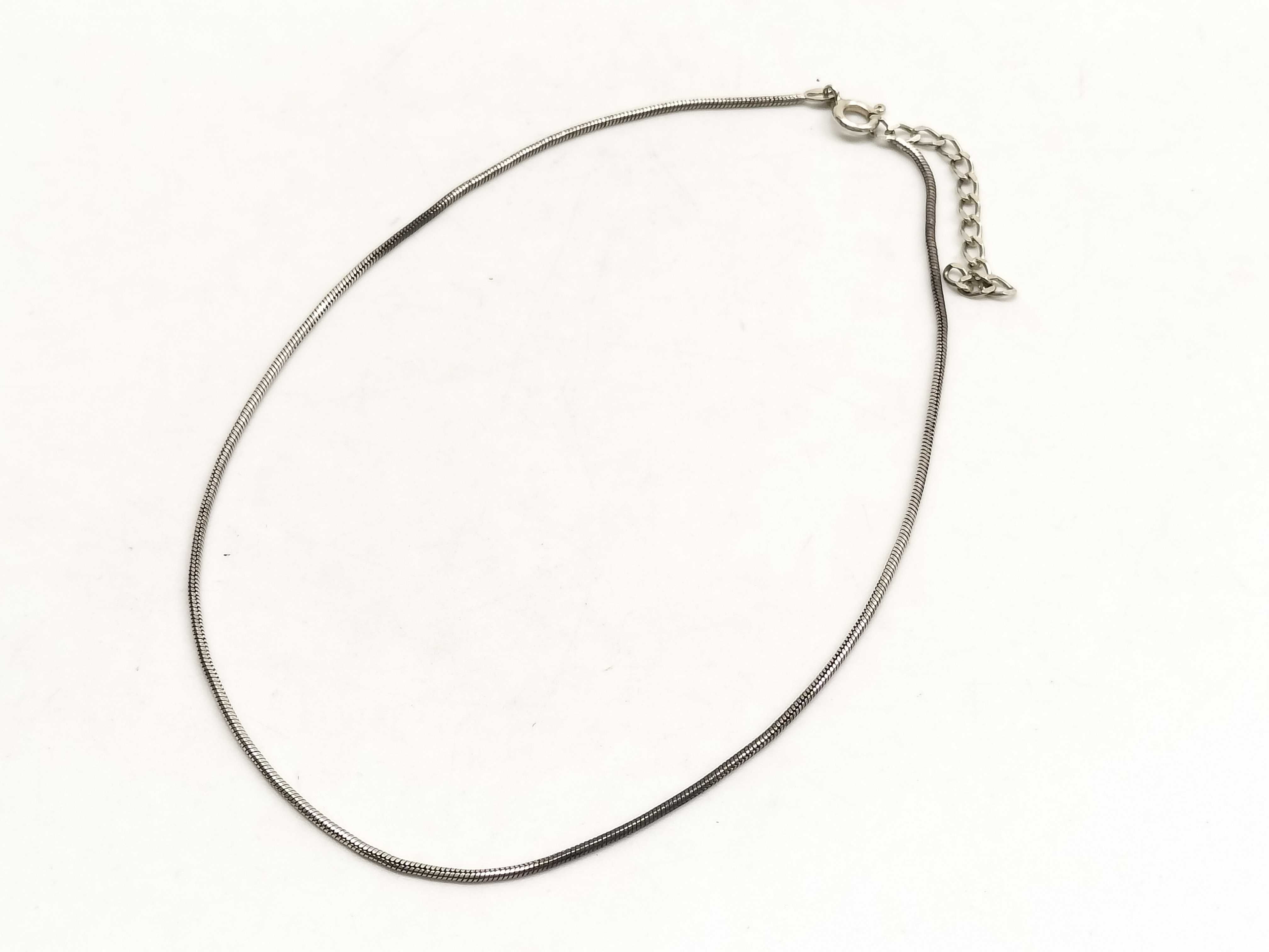 Two Sterling Silver Jewelry Items Including a Snake Chain Necklace and Artisan Band Ring