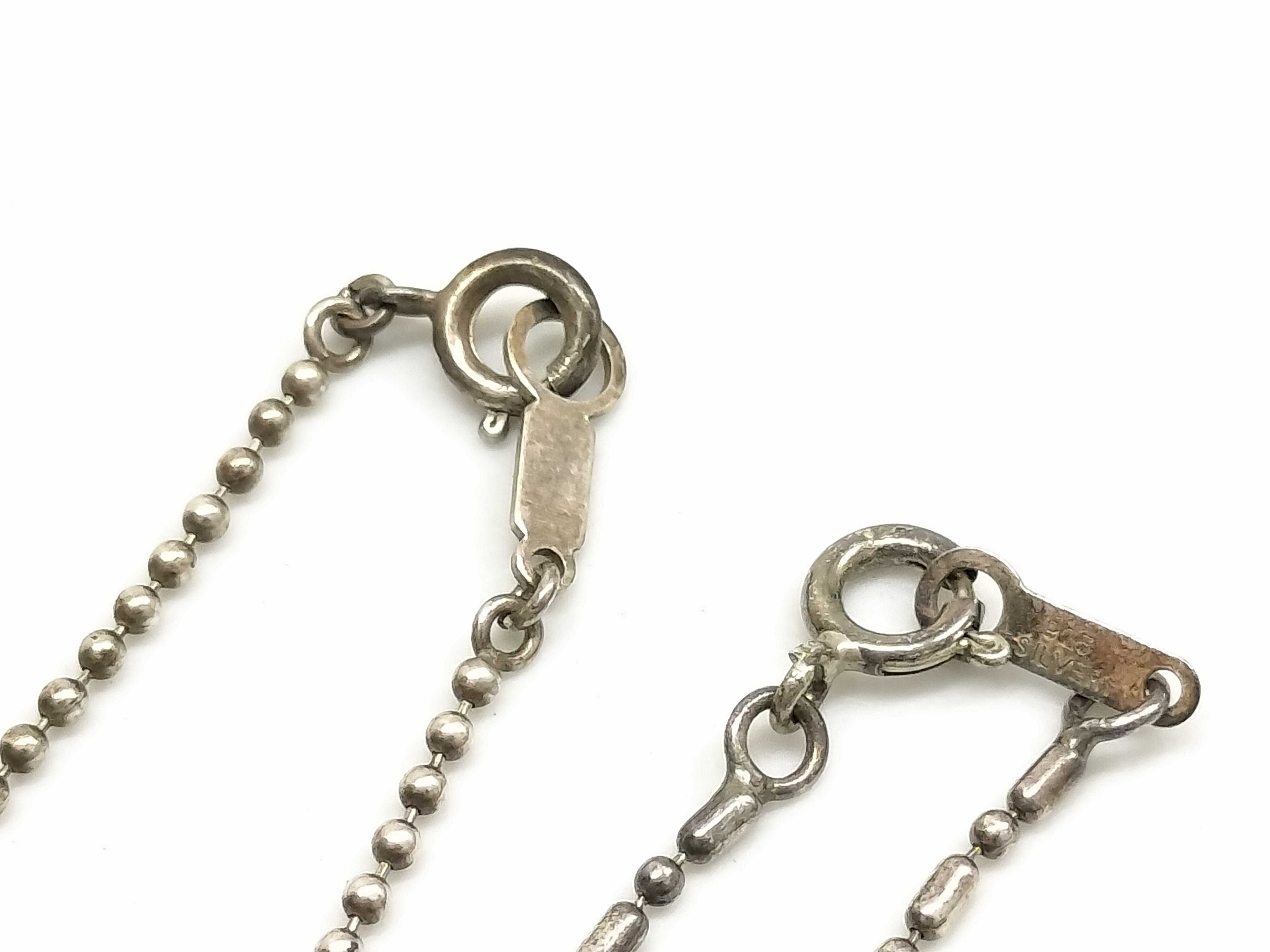 A Group of Sterling Silver and Vermeil Jewelry Including Pearl and Heart Pendants