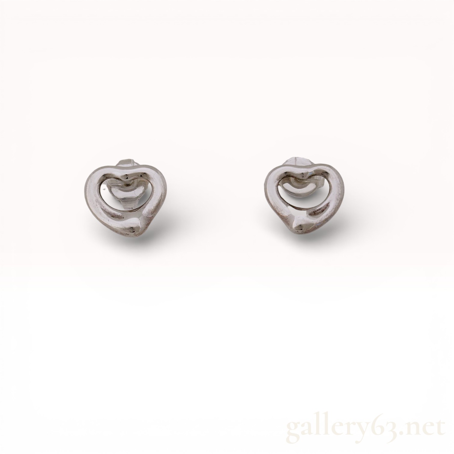 A Pair of Tiffany and Co. Elsa Peretti Sterling Silver Open Heart Stud Earrings