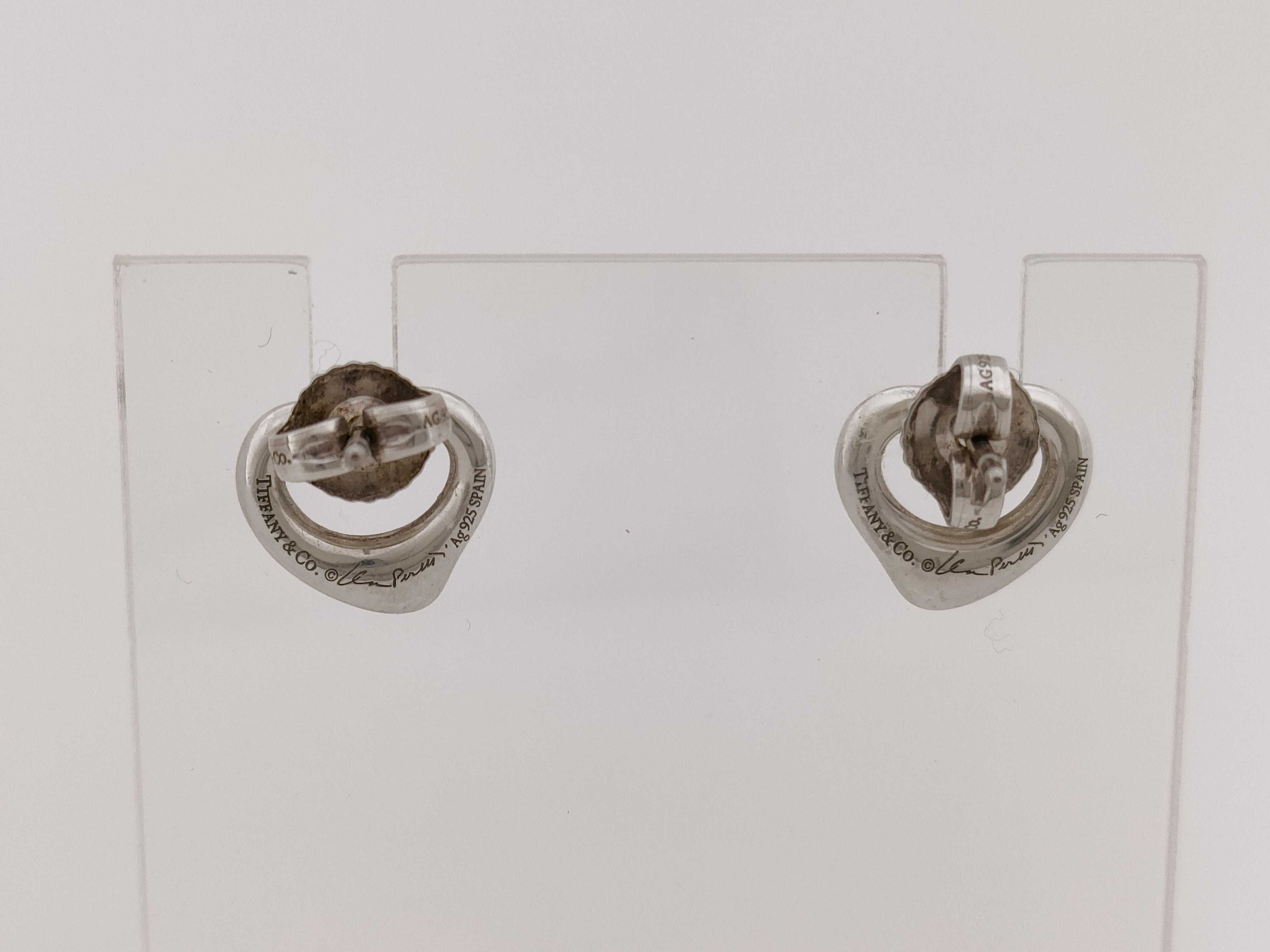 A Pair of Tiffany and Co. Elsa Peretti Sterling Silver Open Heart Stud Earrings
