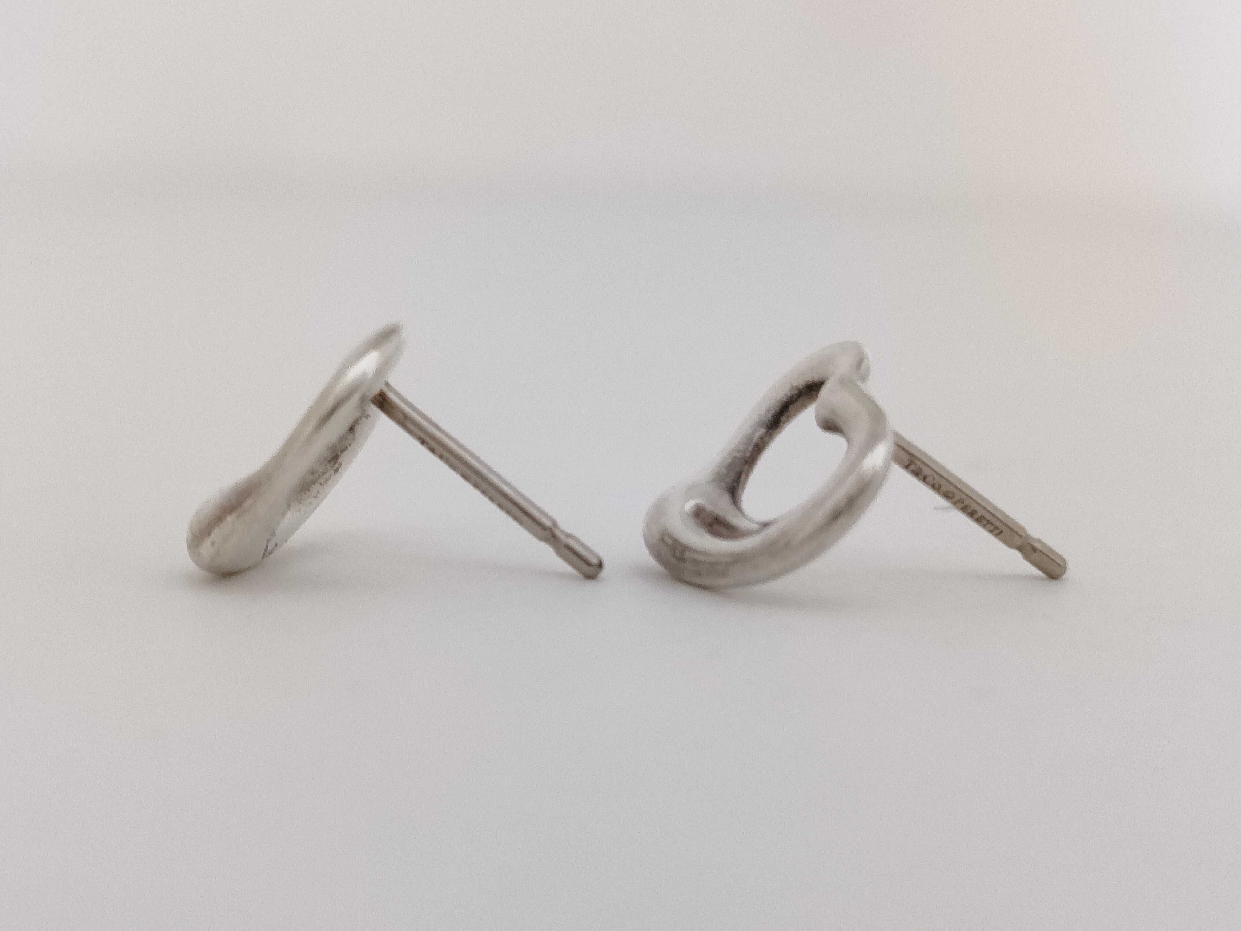 A Pair of Tiffany and Co. Elsa Peretti Sterling Silver Open Heart Stud Earrings