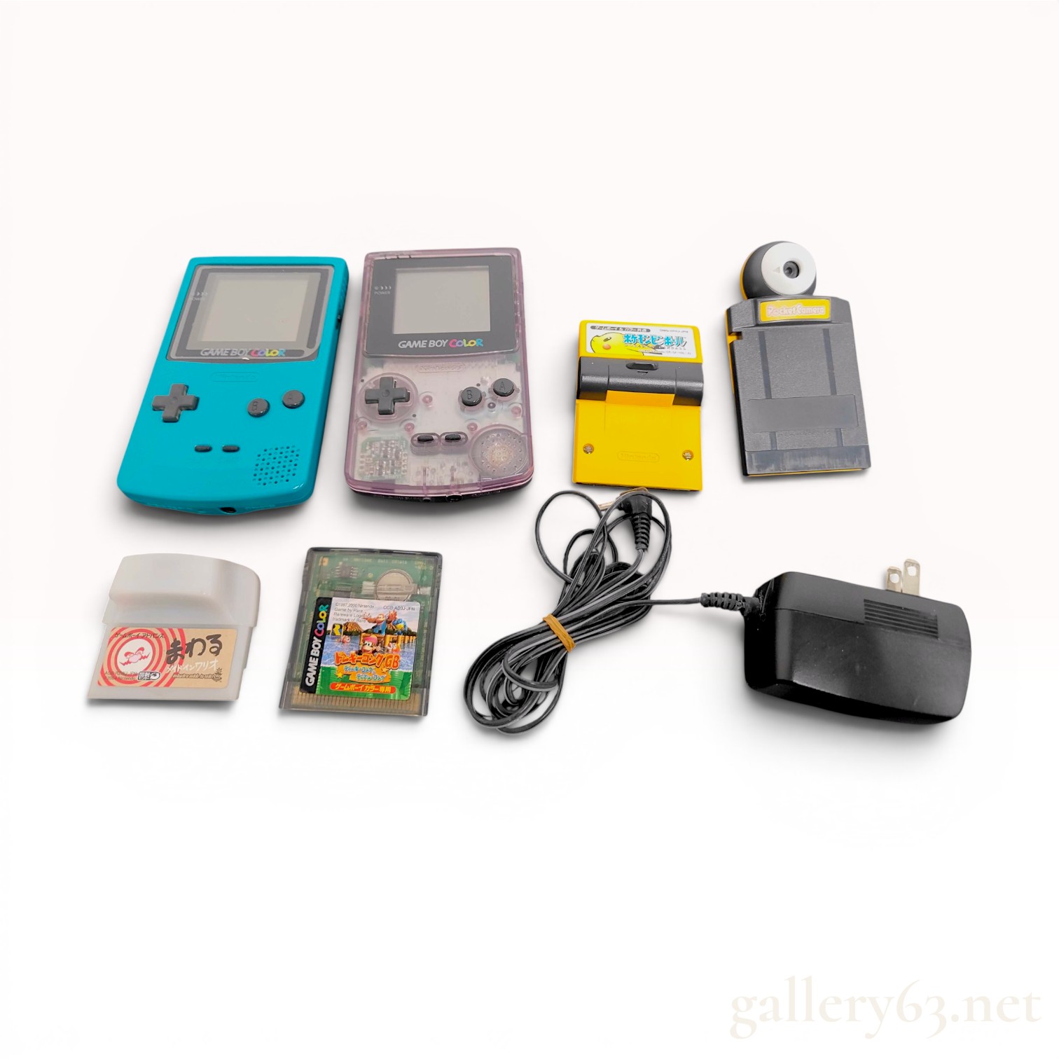 A Collection of Nintendo Game Boy Color Handheld Consoles and Japanese Software