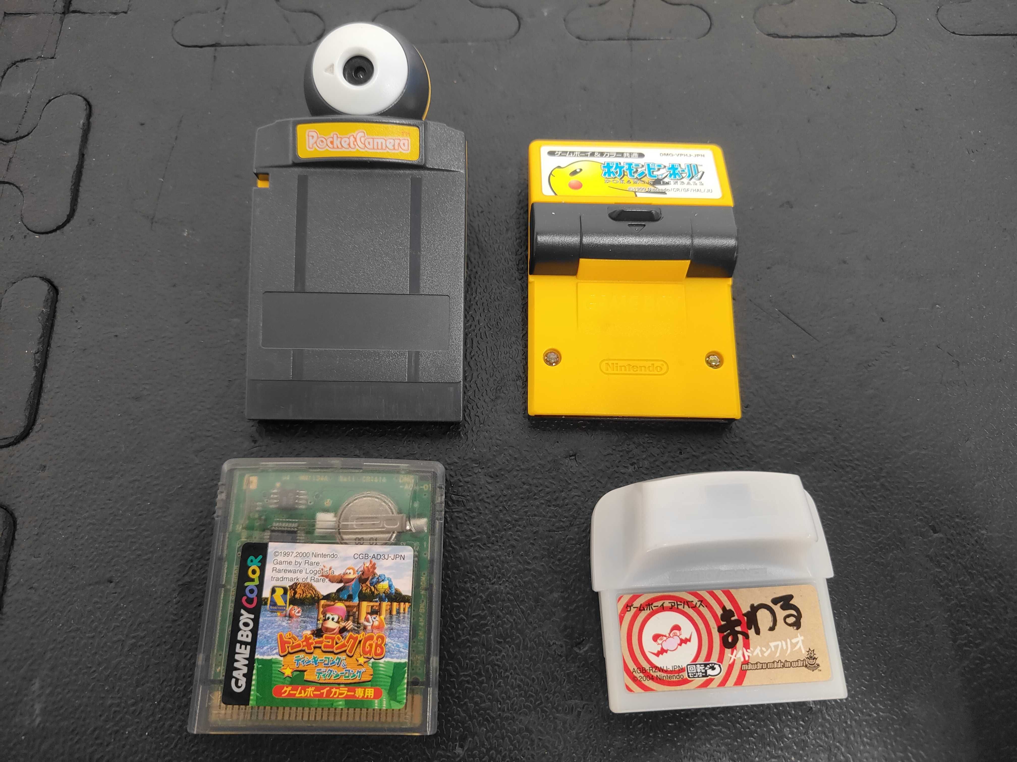 A Collection of Nintendo Game Boy Color Handheld Consoles and Japanese Software