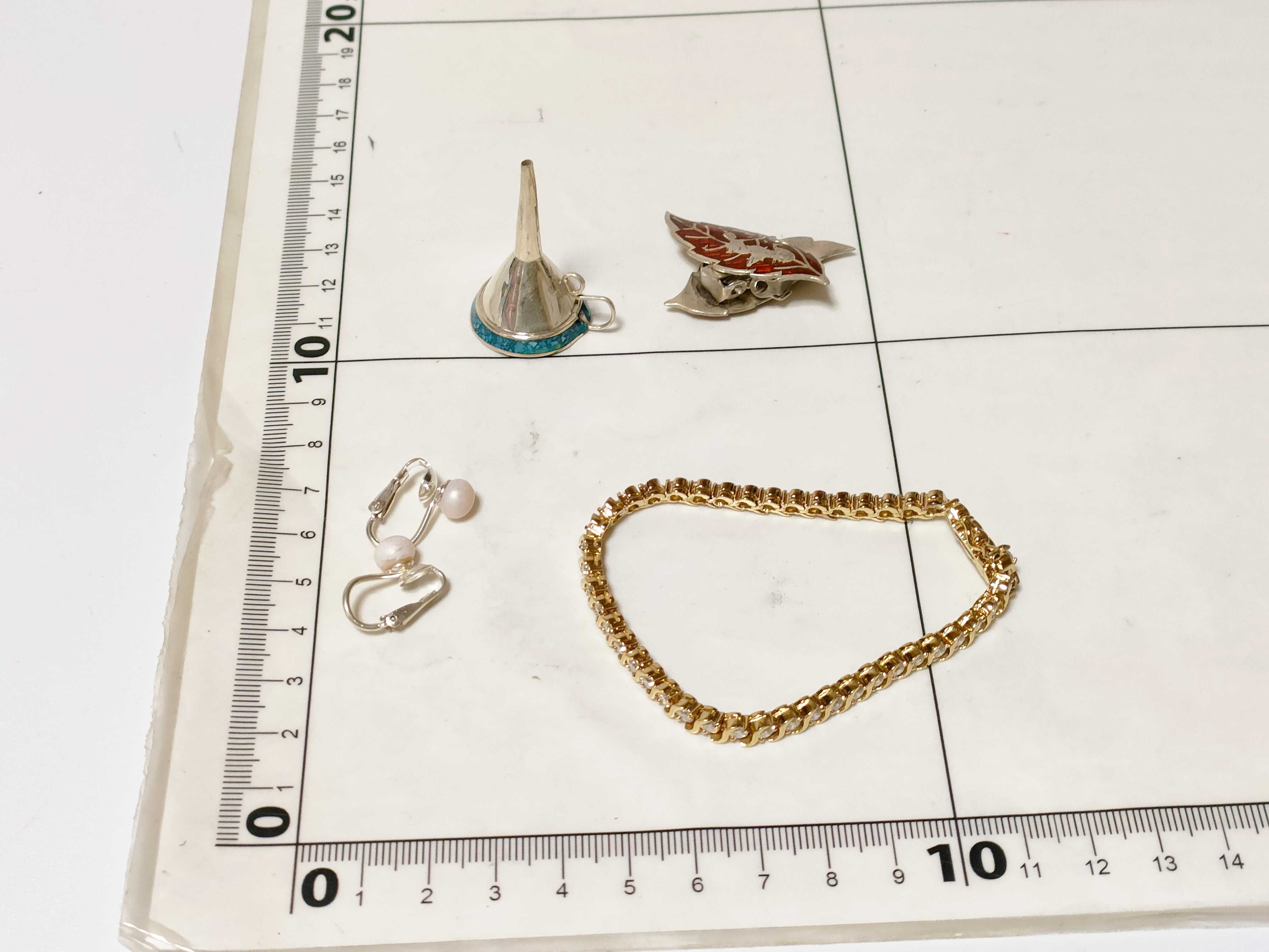An Assortment of Sterling Silver and Costume Jewelry Accessories