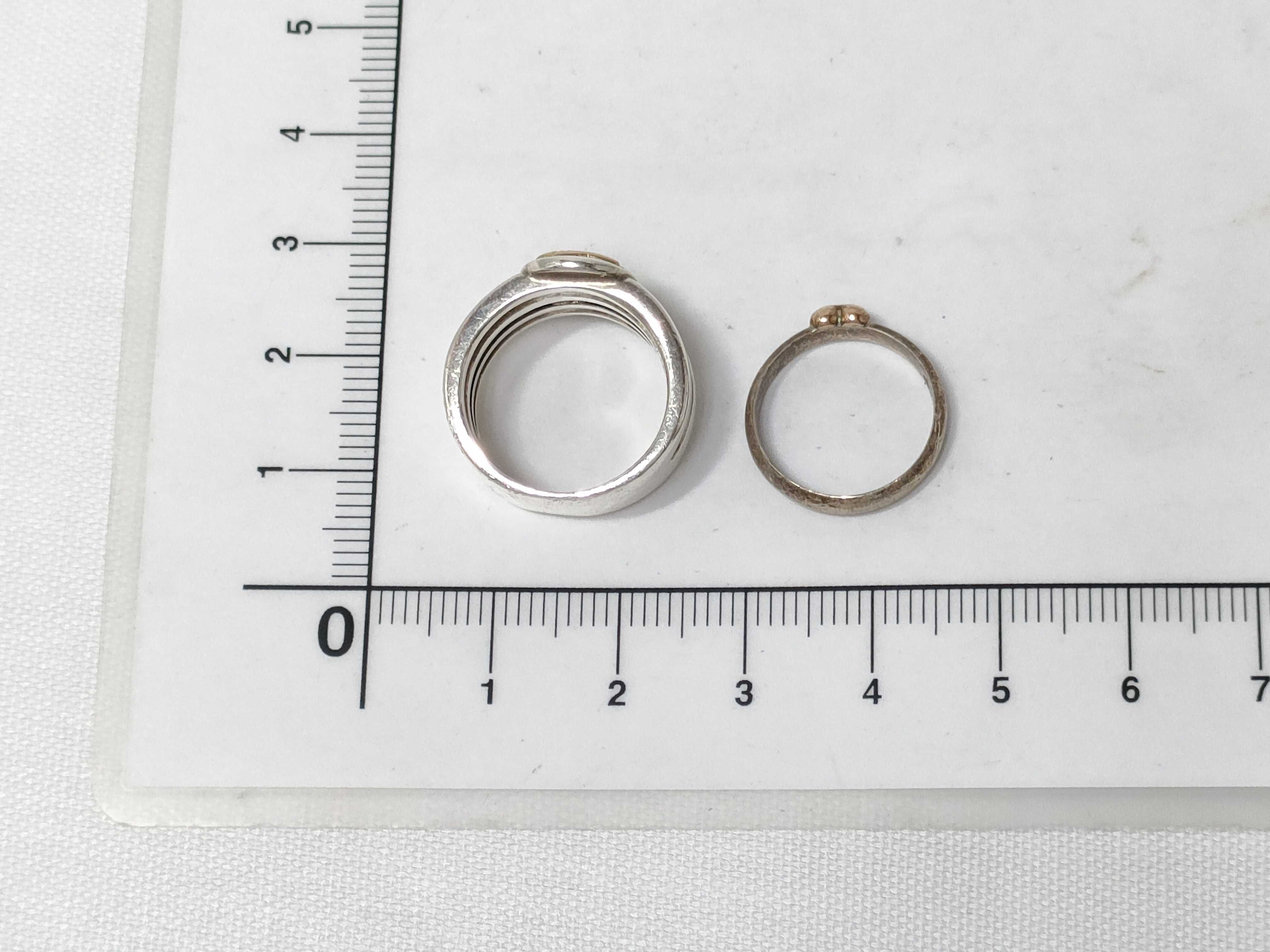 Four Mixed Karat Gold and Sterling Silver Rings