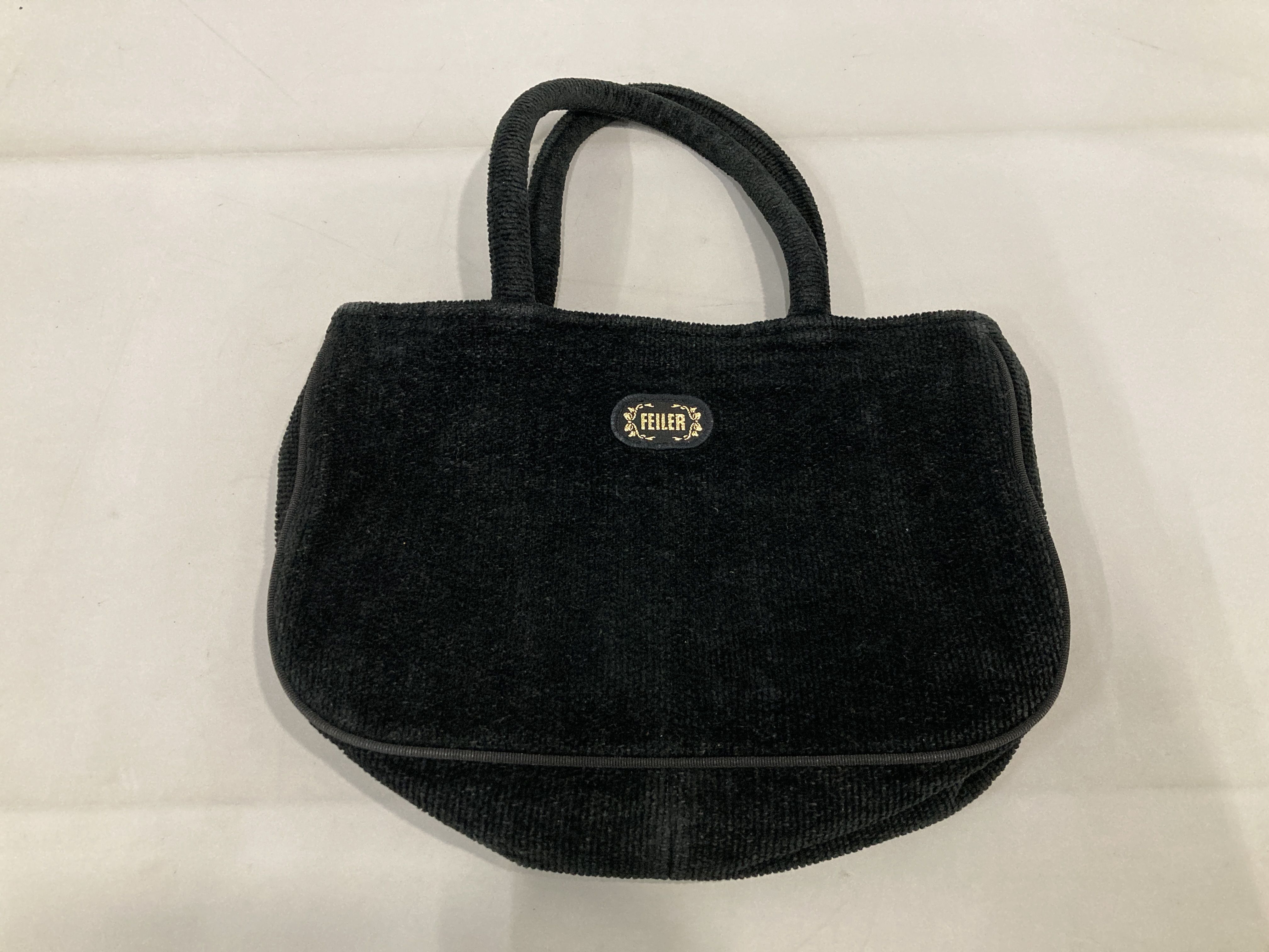 A Set of Five Feiler Chenille and Coated Textile Bags and Pouches