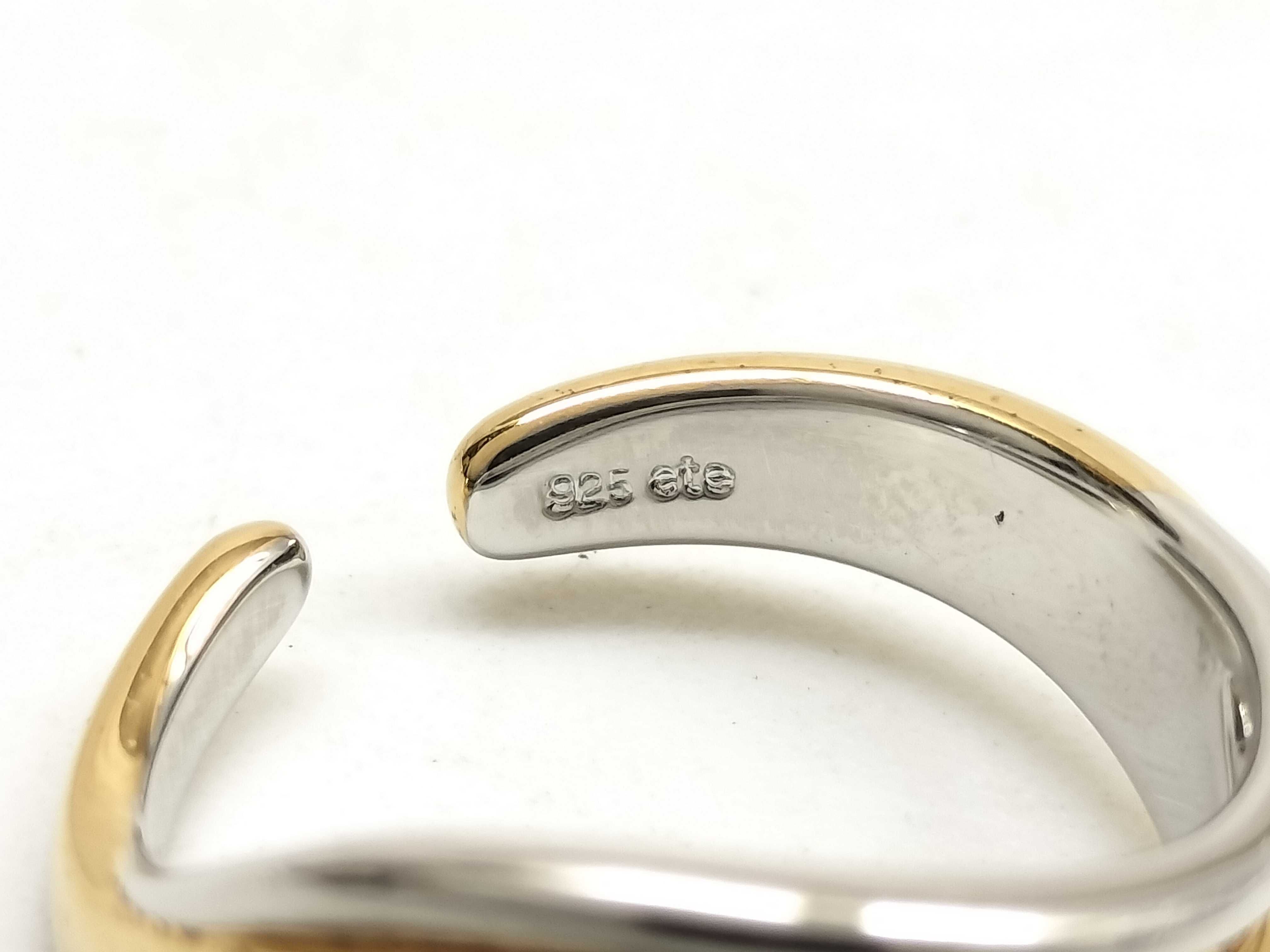Two Pieces of Sterling Silver Jewelry Including an ete Bypass Ring and a 14K Gold Accent Mom Pendant Necklace