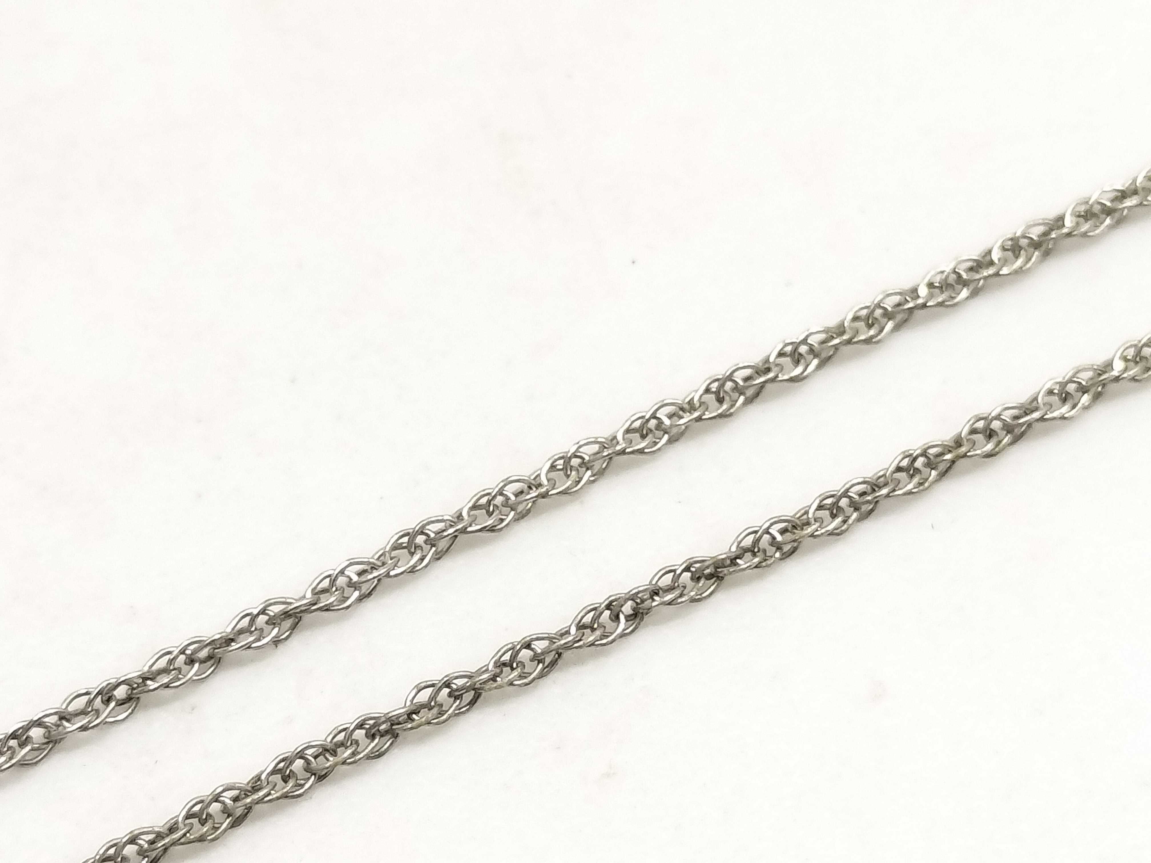 Two Pieces of Sterling Silver Jewelry Including an ete Bypass Ring and a 14K Gold Accent Mom Pendant Necklace