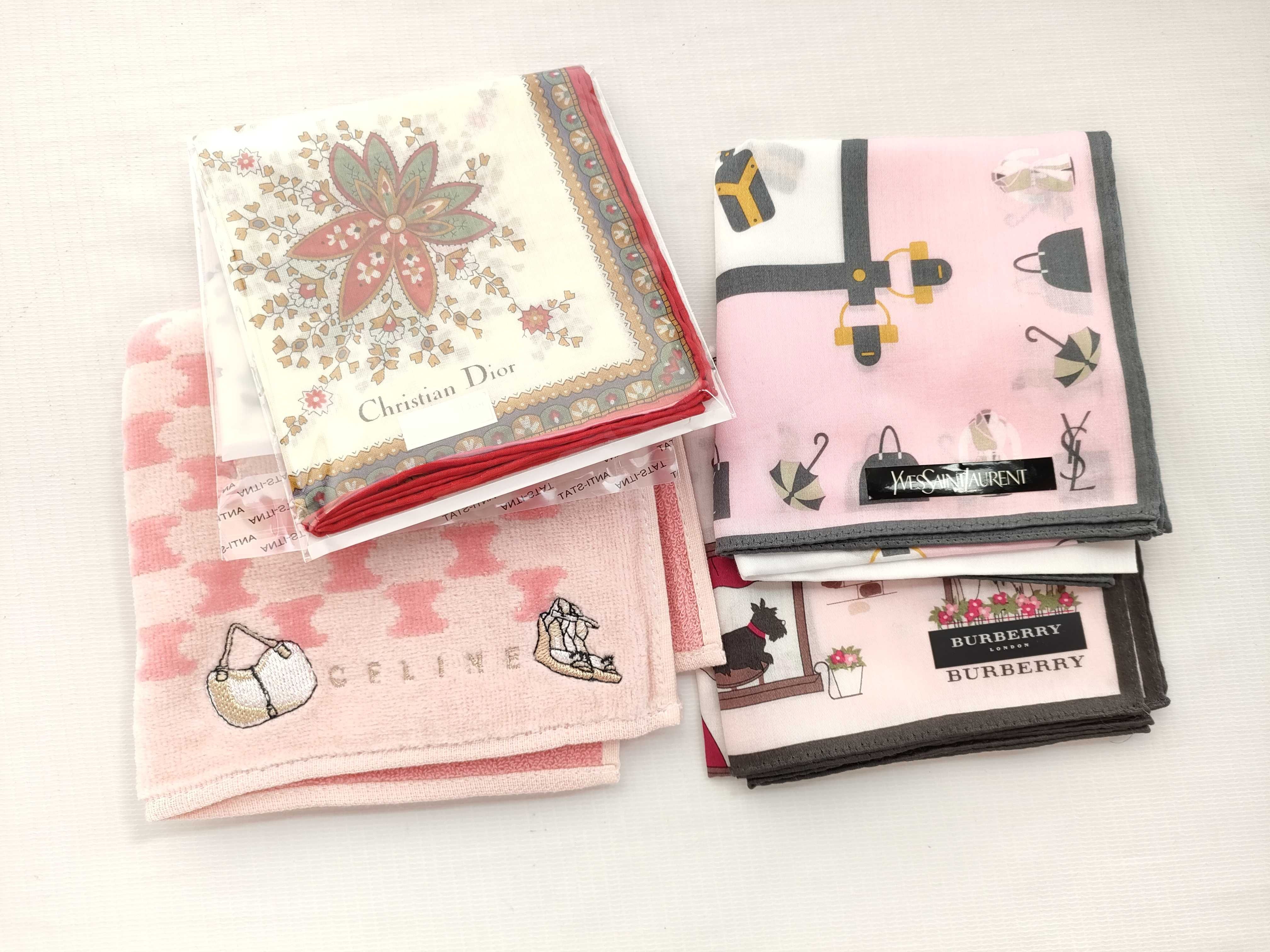 A Collection of Eight Designer Pocket Squares and Pocket Towels including Burberry, Christian Dior, Celine, and Yves Saint Laurent