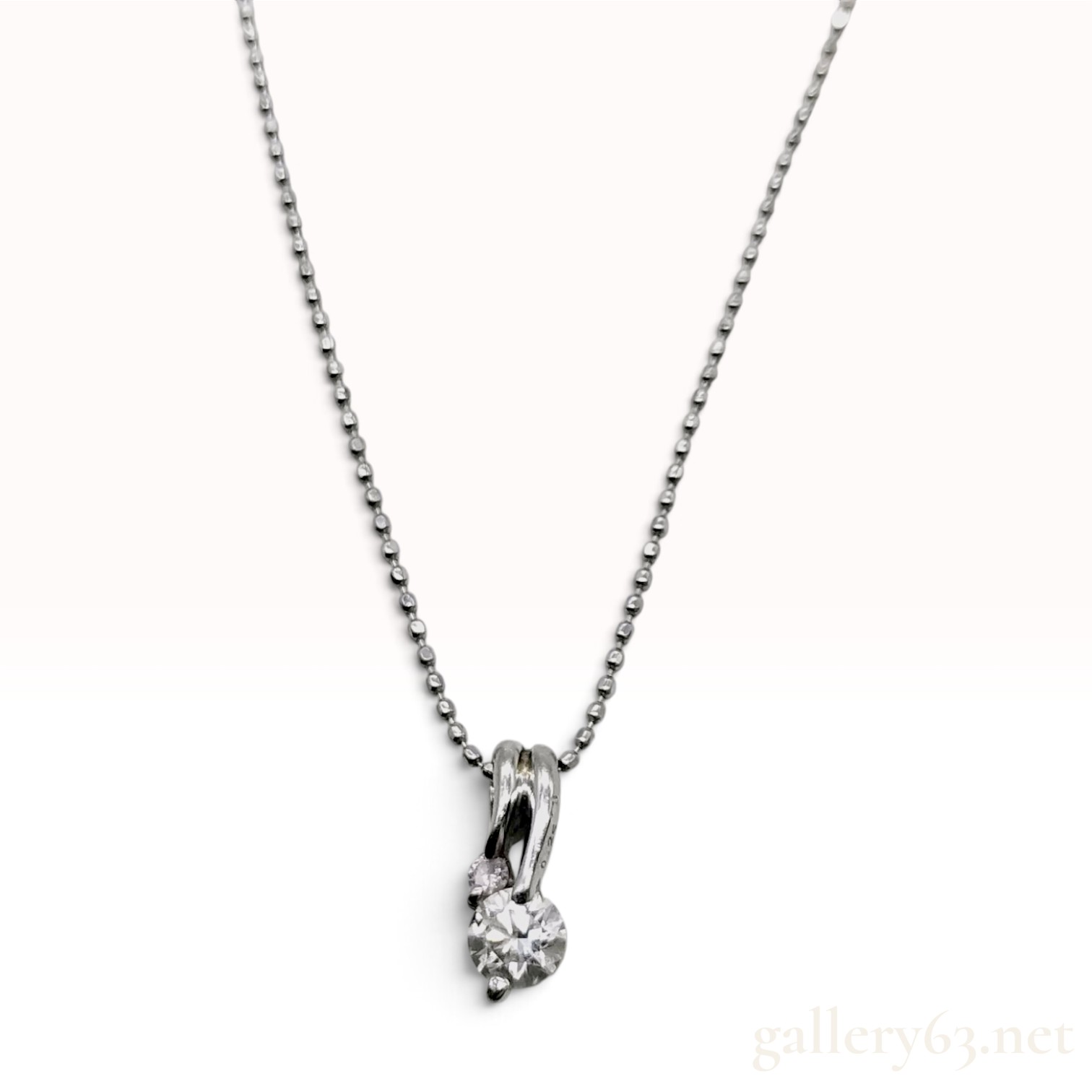 Diamond and Platinum Bypass Pendant Necklace with 0.25 Carat Diamond