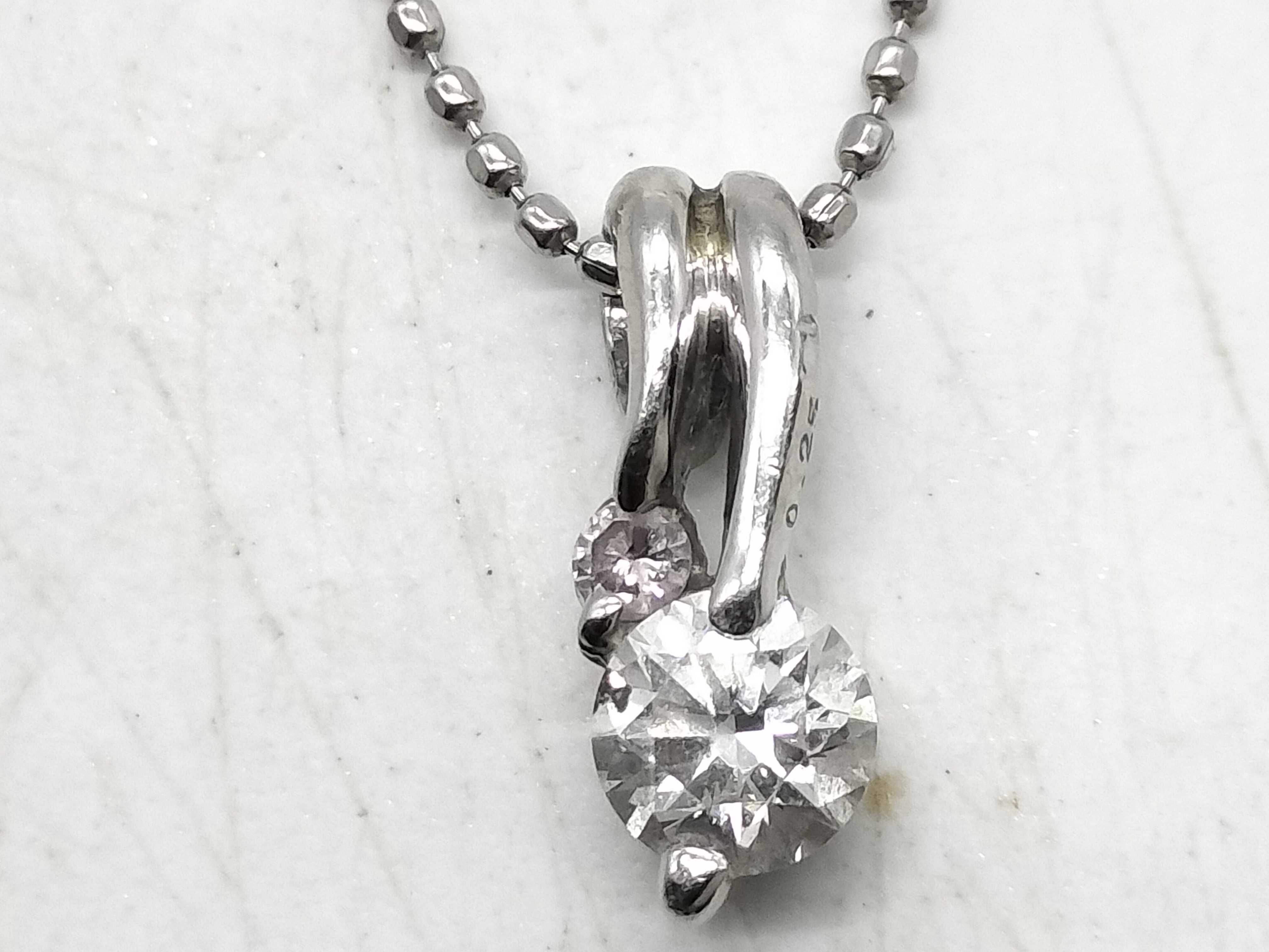 Diamond and Platinum Bypass Pendant Necklace with 0.25 Carat Diamond