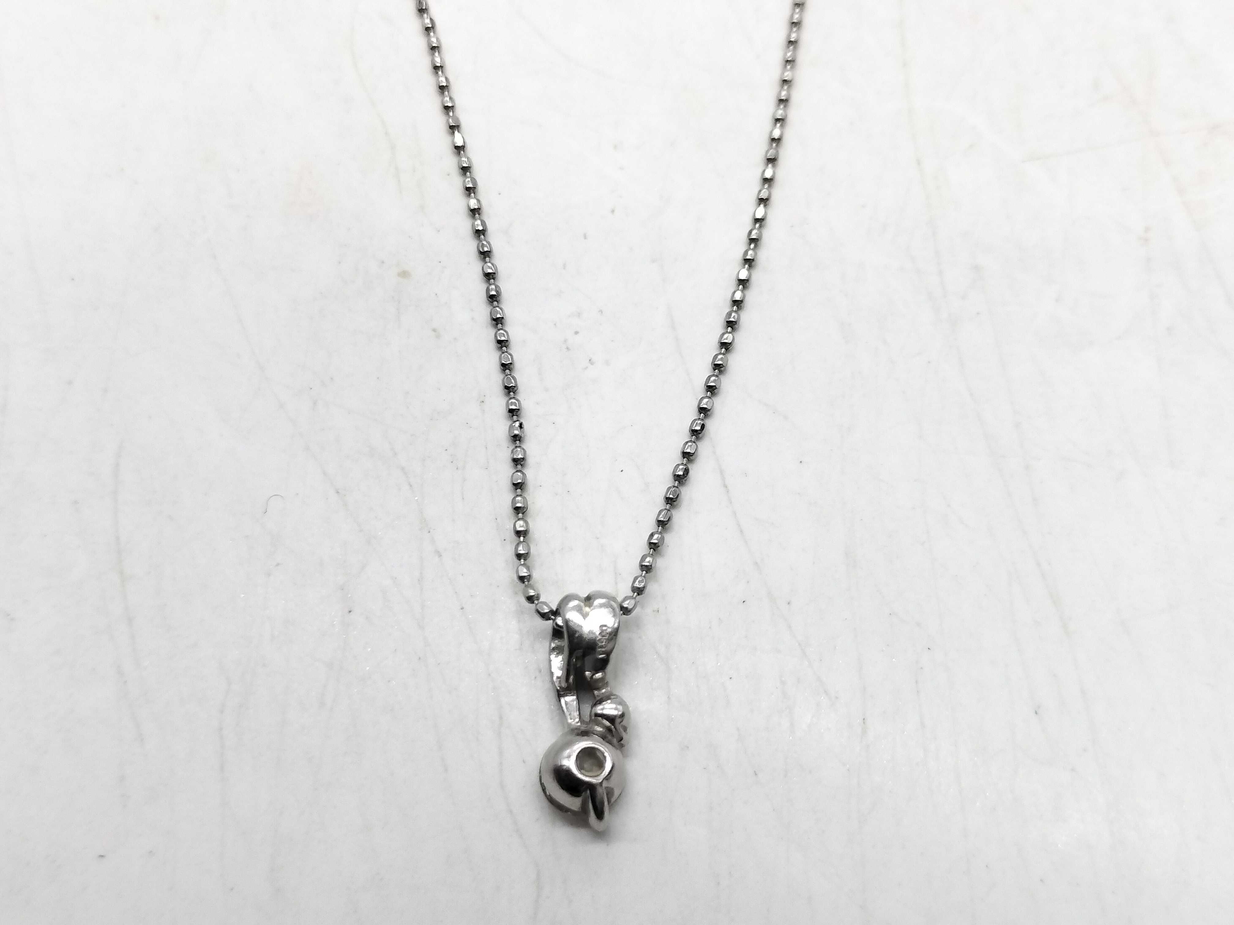 Diamond and Platinum Bypass Pendant Necklace with 0.25 Carat Diamond