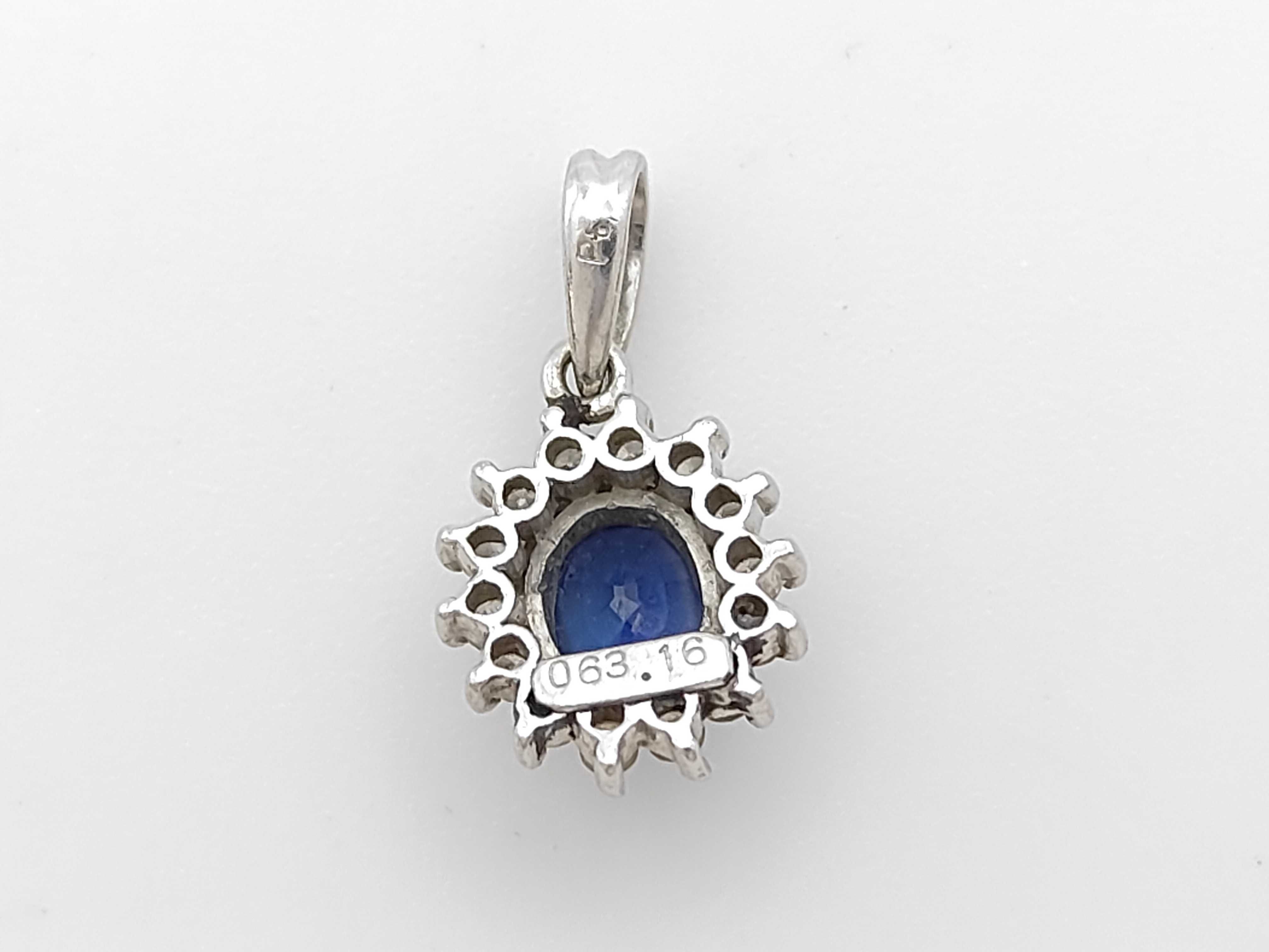 Platinum Blue Sapphire and Diamond Halo Pendant, S0.63ct D0.16ct