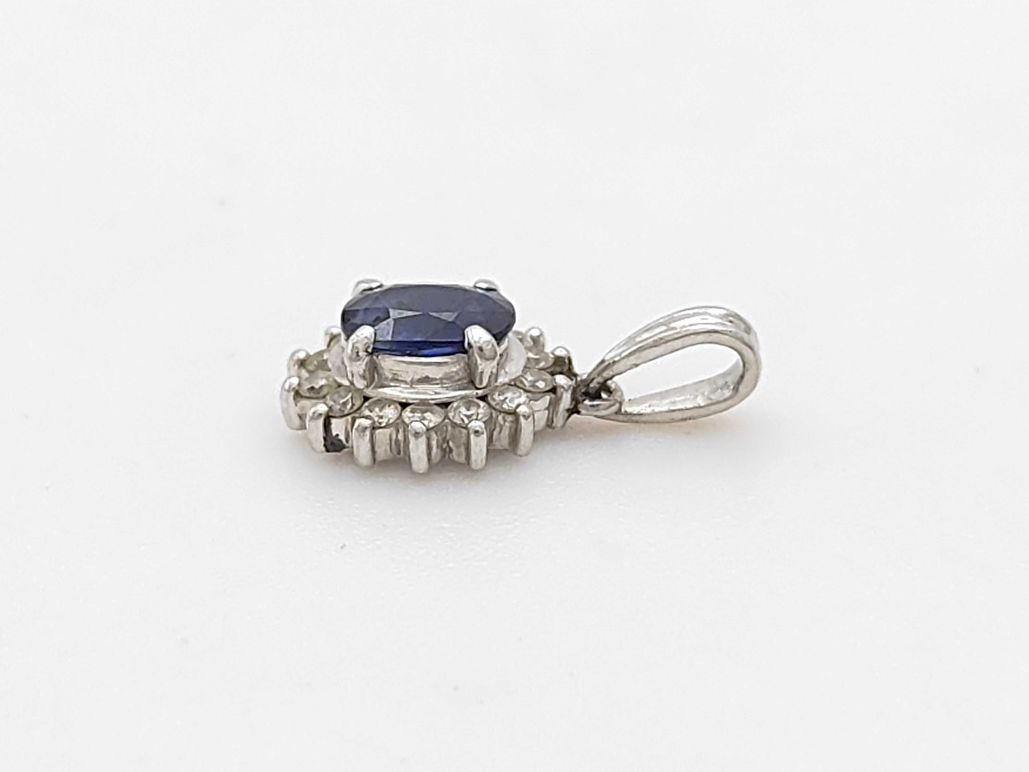 Platinum Blue Sapphire and Diamond Halo Pendant, S0.63ct D0.16ct
