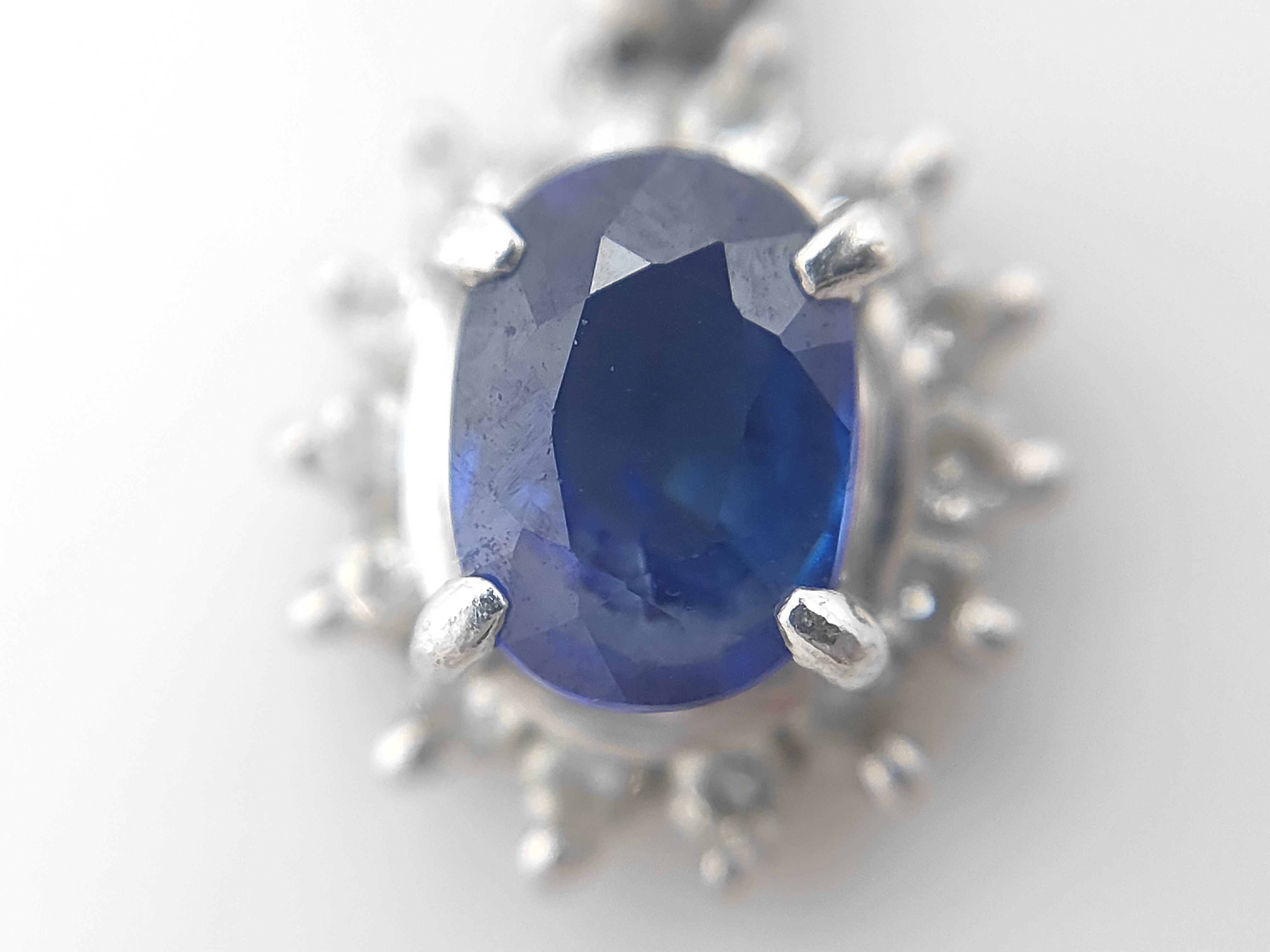 Platinum Blue Sapphire and Diamond Halo Pendant, S0.63ct D0.16ct