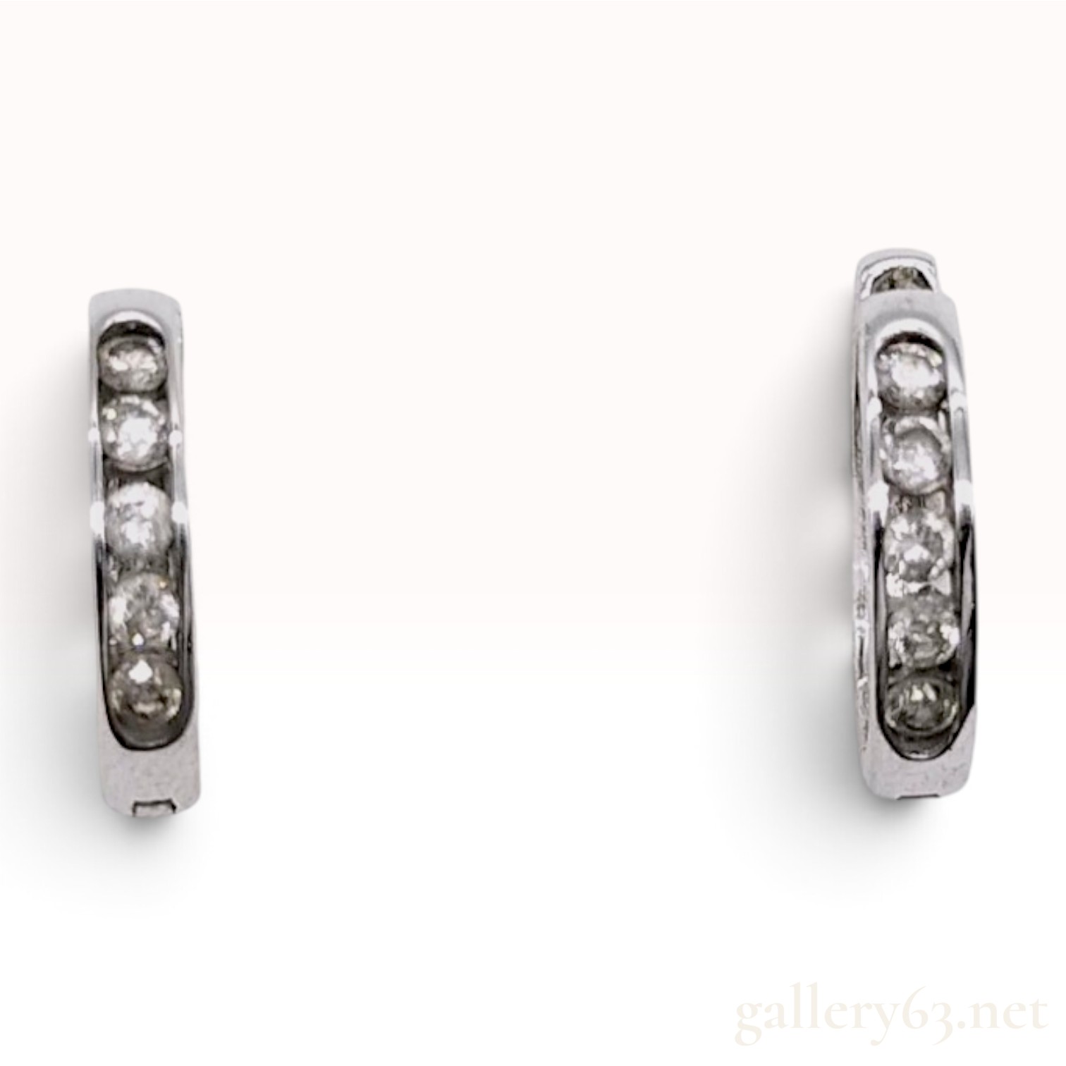 A Pair of 18K White Gold and Diamond Huggie Hoop Earrings