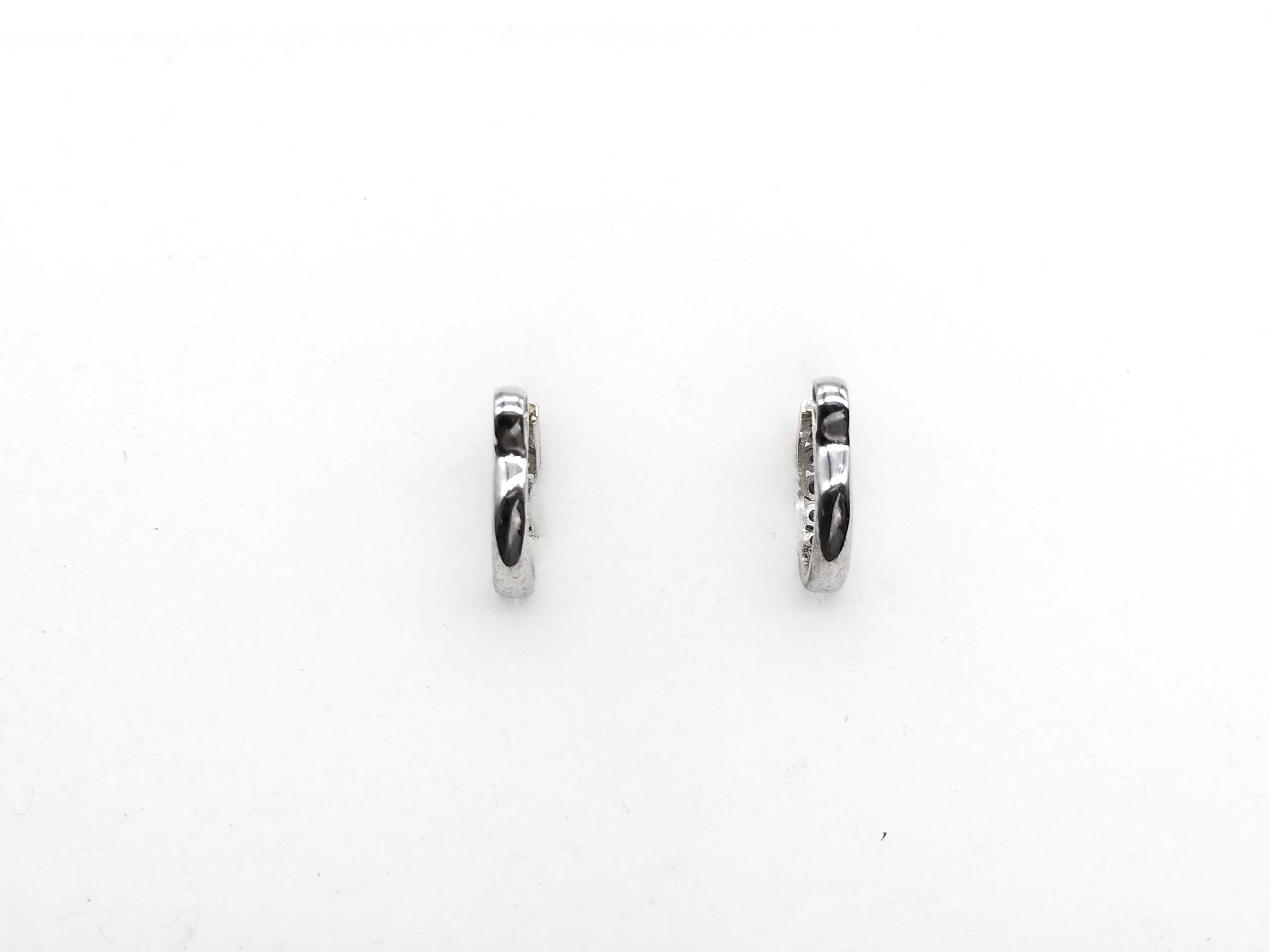 A Pair of 18K White Gold and Diamond Huggie Hoop Earrings
