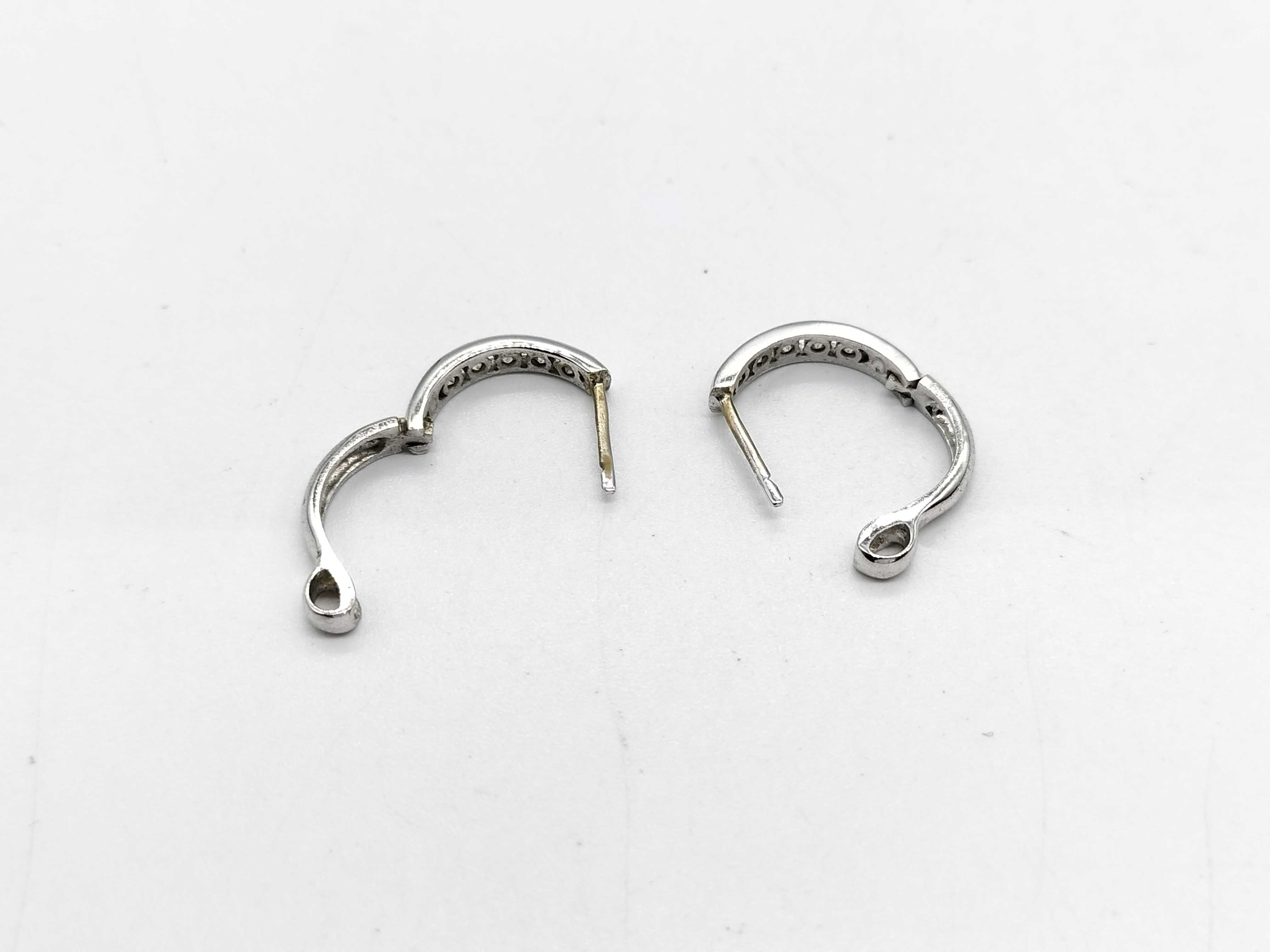 A Pair of 18K White Gold and Diamond Huggie Hoop Earrings
